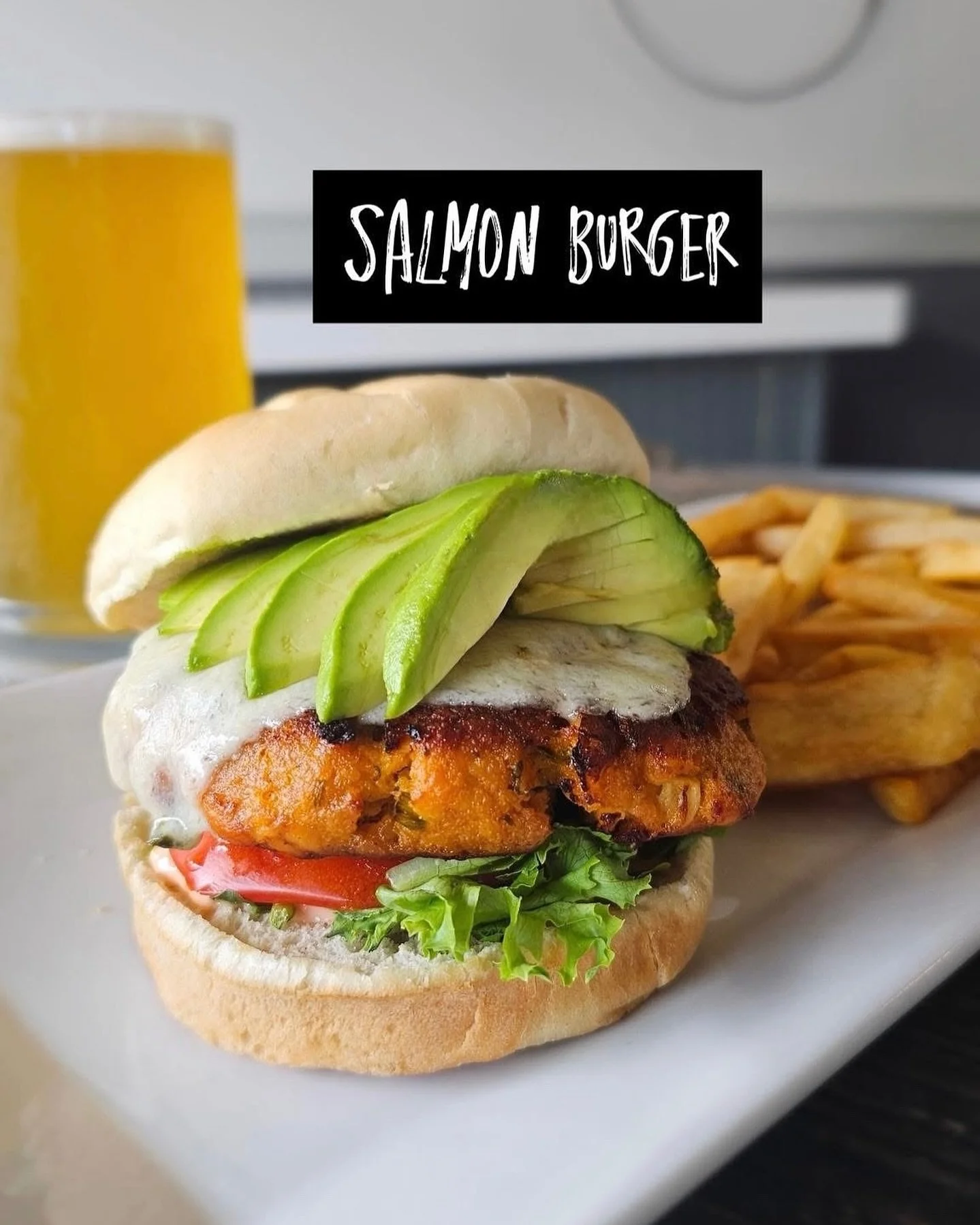 When the heat hits 90&deg; degrees, leave the cooking to @citystreetsrest. 🌞 

Sink your teeth into our new Salmon Burger &ndash; perfectly grilled, layered with pepper jack, ripe avocado, and tangy thousand island, all on a golden toasted bun. Fres