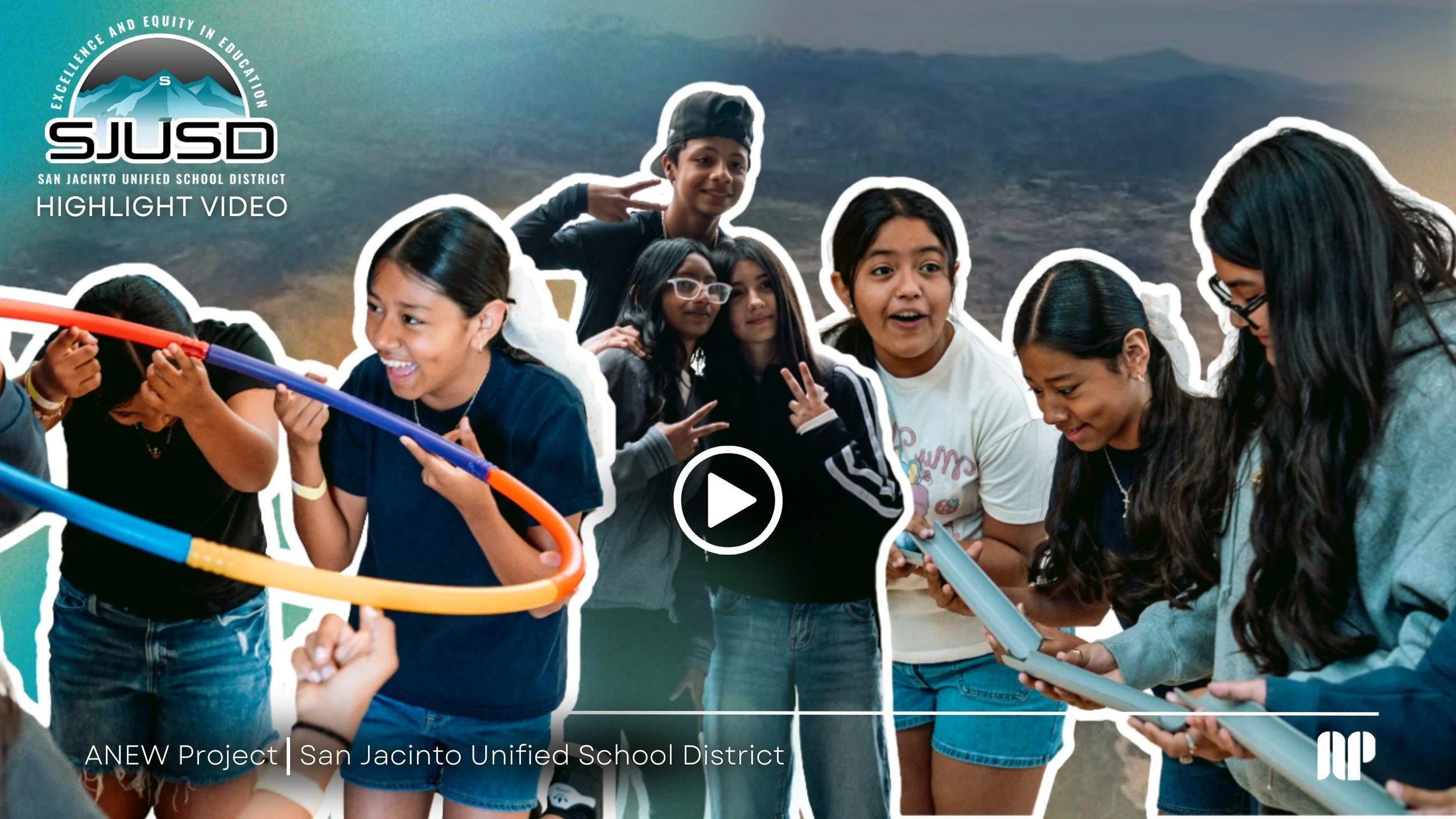 Group of diverse students engaged in an outdoor activity, holding tubes and devices, with a scenic mountain background, promoting education excellence in the San Jacinto Unified School District.