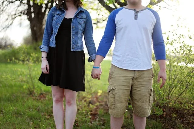 Couple holding hands outside