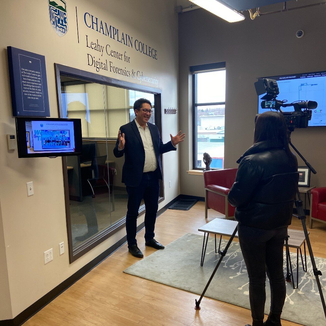 Our fantastic @junaprcommunications crew capturing exclusive moments as @champlainedu President Alex Hernandez discusses Champlain&rsquo;s groundbreaking cybersecurity collaboration with @nuharboursecurity. 📸✨ #BehindTheScenes