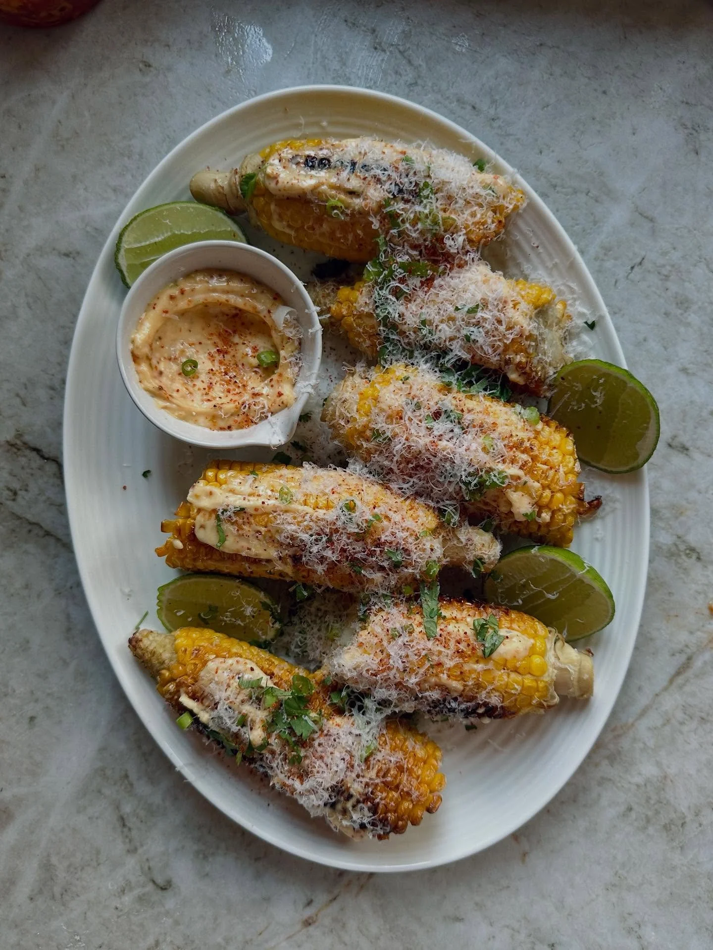 Corn season 🌽 my take on &lsquo;Elotes&rsquo; entirely inspired by my friend Seb who made us these when we last visited - charred corn, coated in homemade @tajinuk mayonnaise, gratings of Parmesan and a squeeze of fresh lime - salty, sweet, spicy an