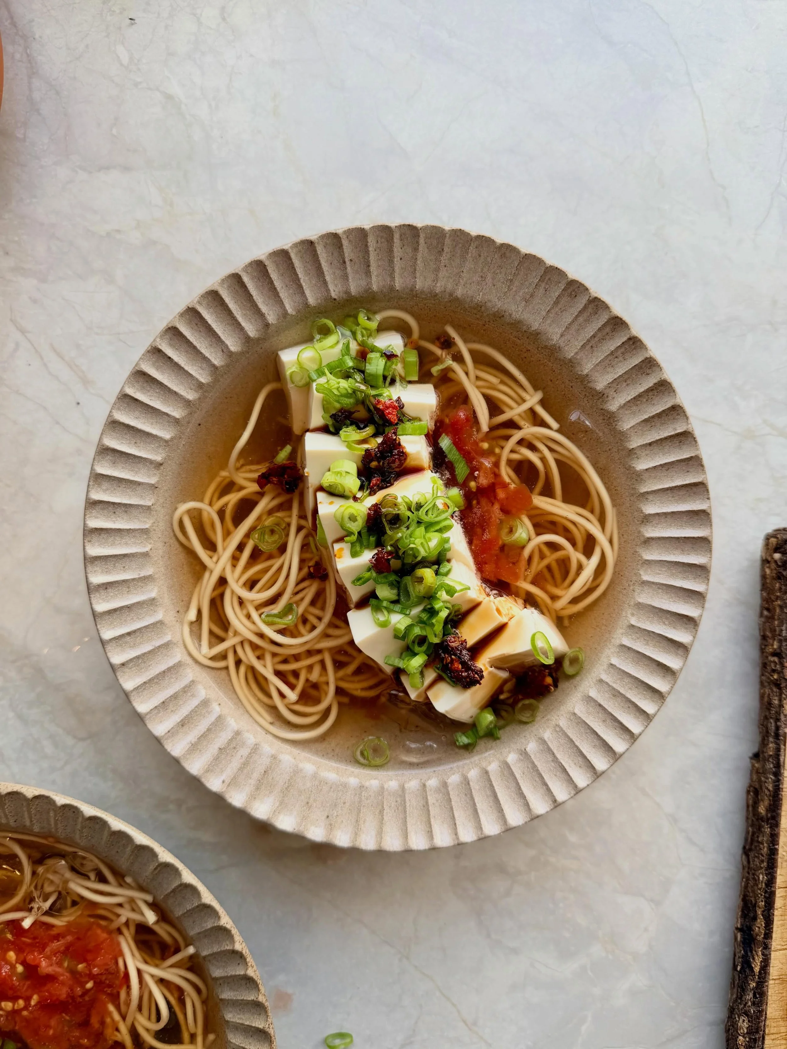 Very much a cold food only kind of day. 🌞 Cold noodle soups really having a moment, so I happily jumped on the train. Ice cold tomato dashi, noodles, silken tofu, crispy chilli oil, spring onions &amp; a drizzle of dam dac soy sauce (my addiction si