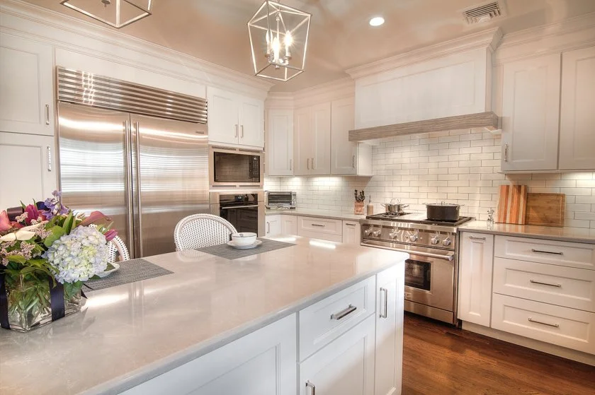 Modern white kitchen with a large central island.