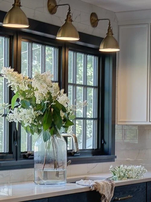 Kitchen Sink With Brass Sconces