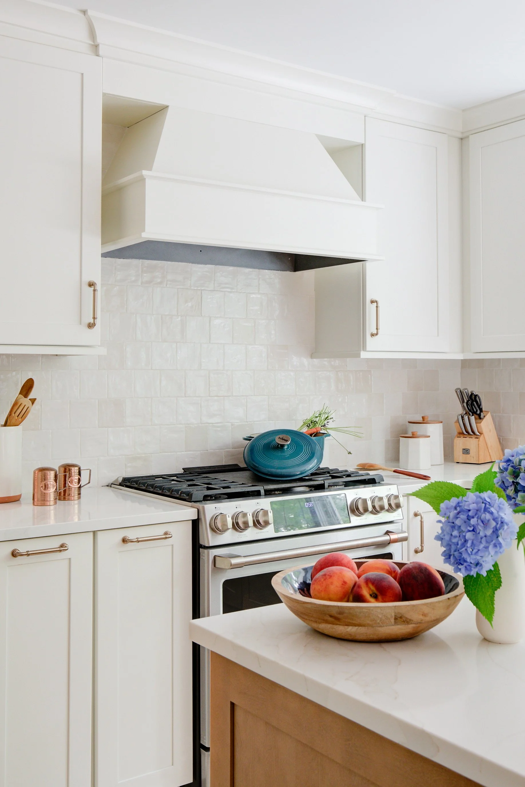 Blue Dutch oven sits on stainless steel stovetop.