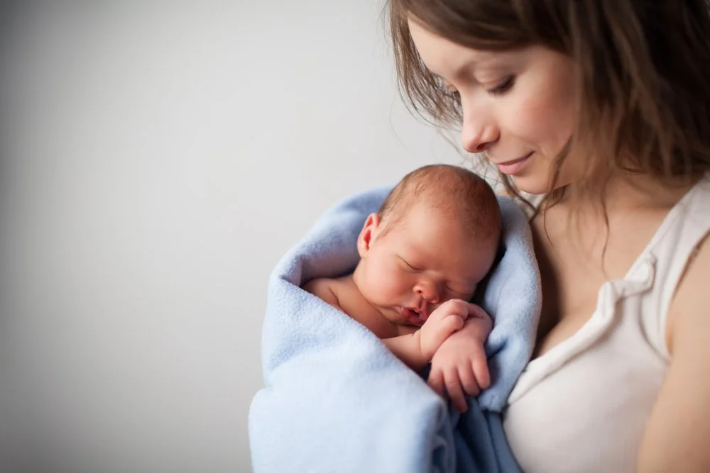 Mother holding her infant | SACCounty Healthy Beginnings