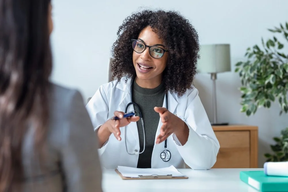 Doctor speaking with her patient