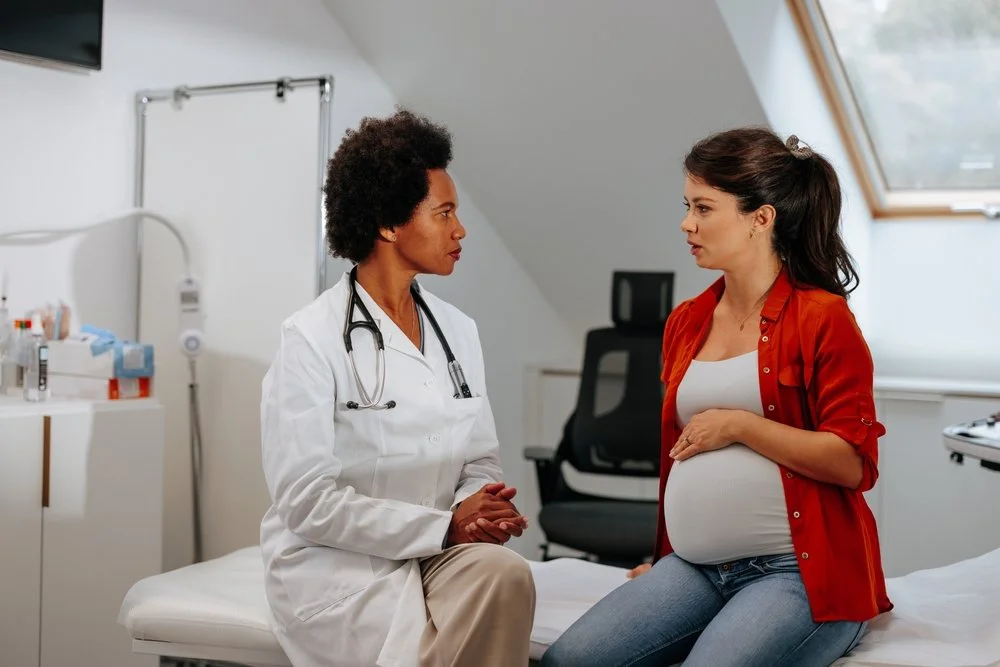 Doctor having intimate conversation with patient | SACCounty Healthy Beginnings