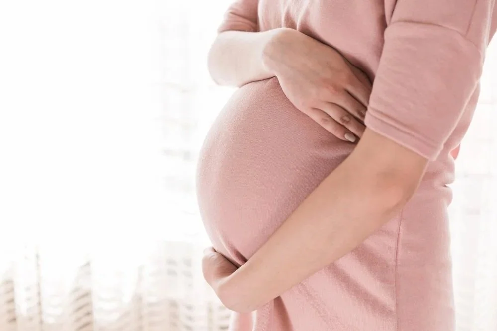 Profile of a pregnant belly