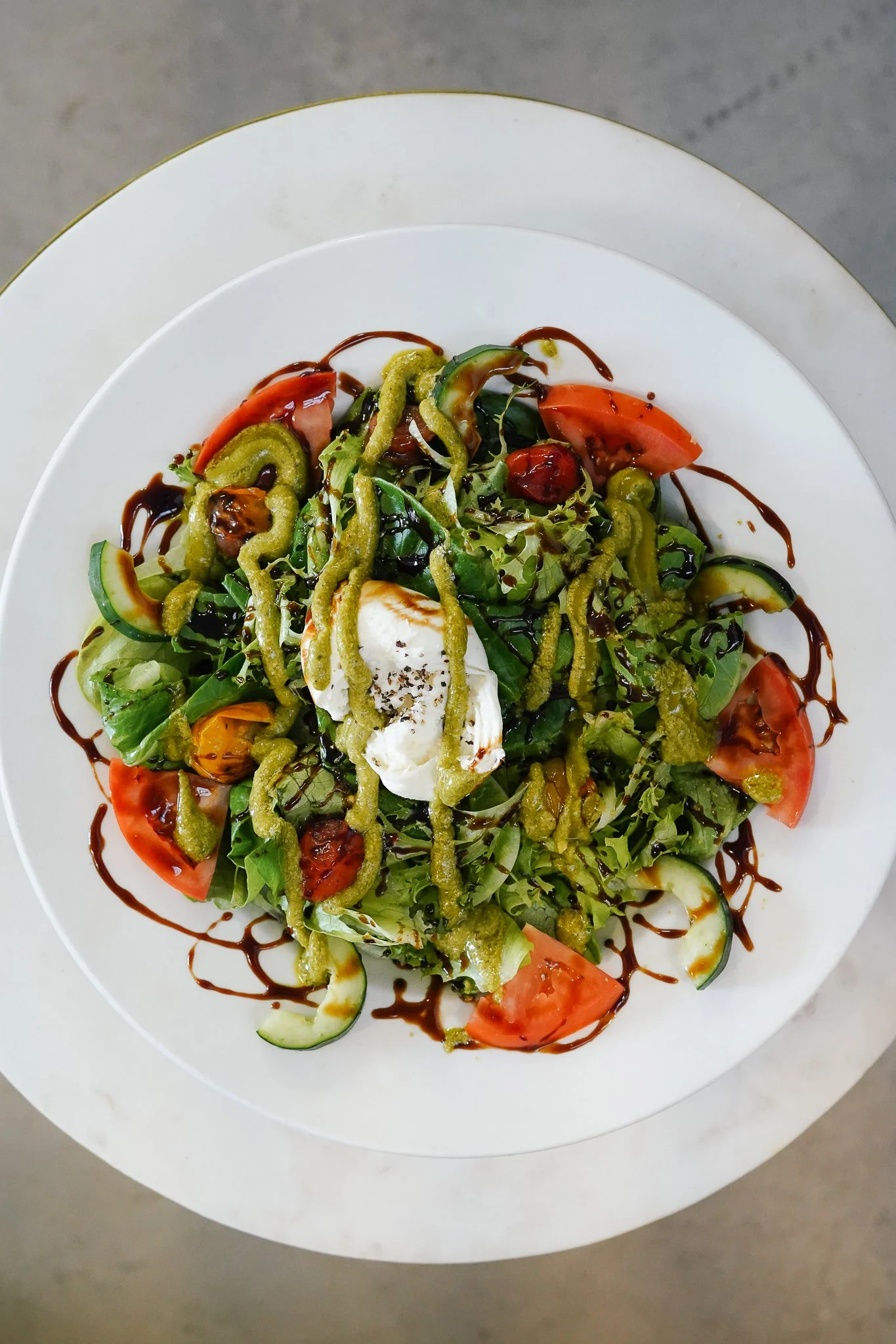 Hydroponic mixed greens, burrata cheese, confit tomato, cucumber, pistachio & mint pesto, EVOO, balsamic