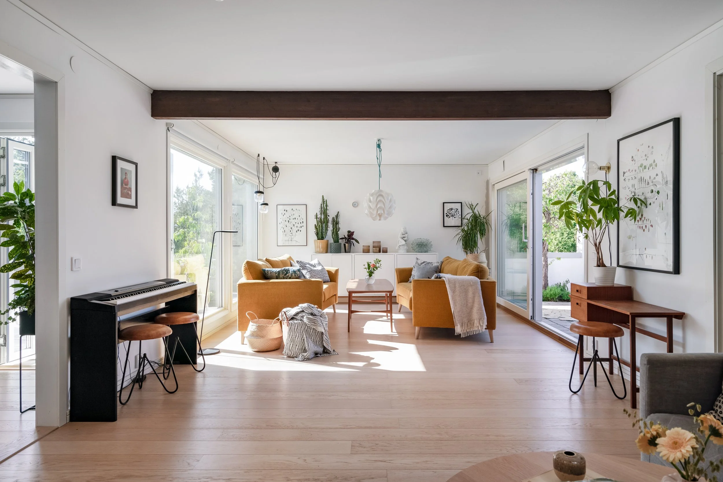 bright livingroom with large windows and cosy interior design