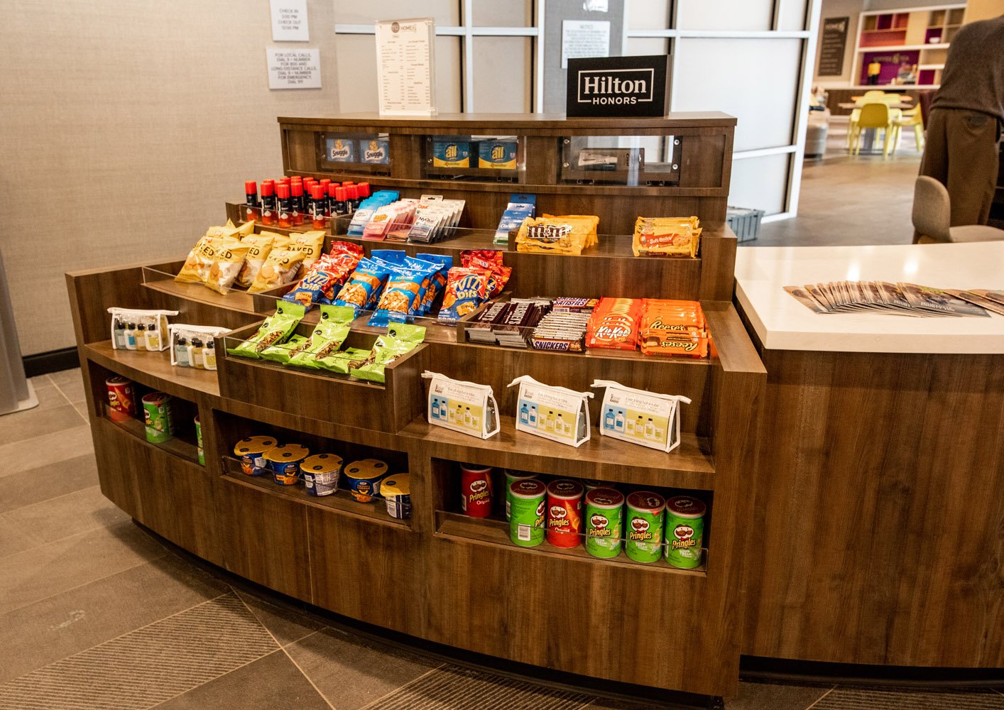 snacks and essentials available for purchase in custom millwork display