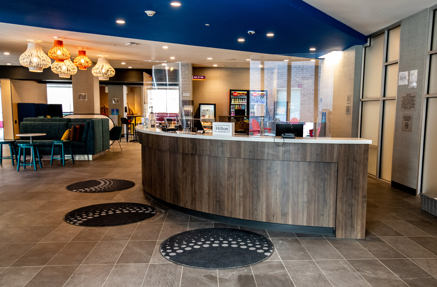 Tru by Hilton and Home2 Suites reception desk featuring custom millwork