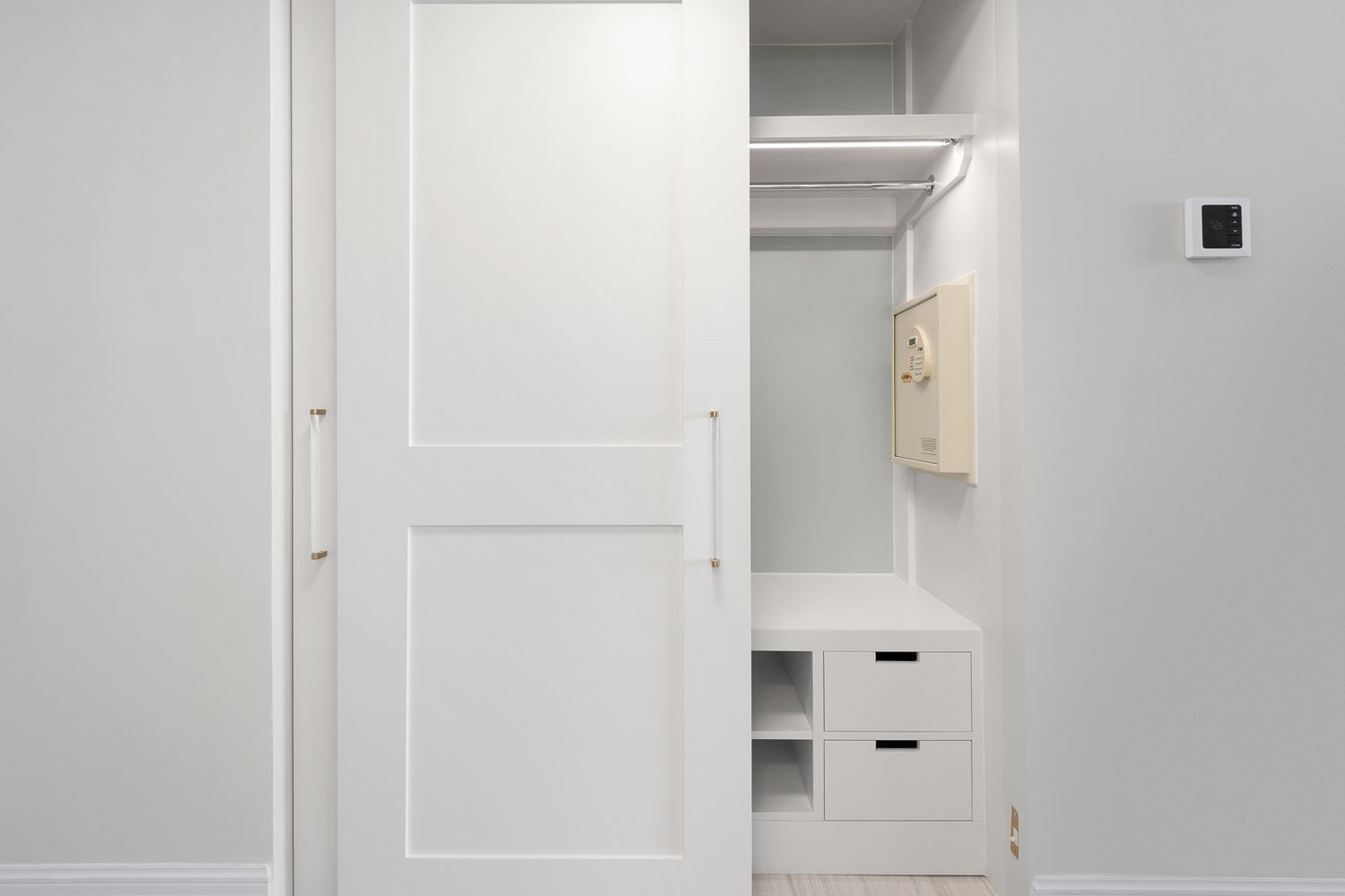 Drawers, shelving, and sliding doors in Ritz-Carlton guest room closets