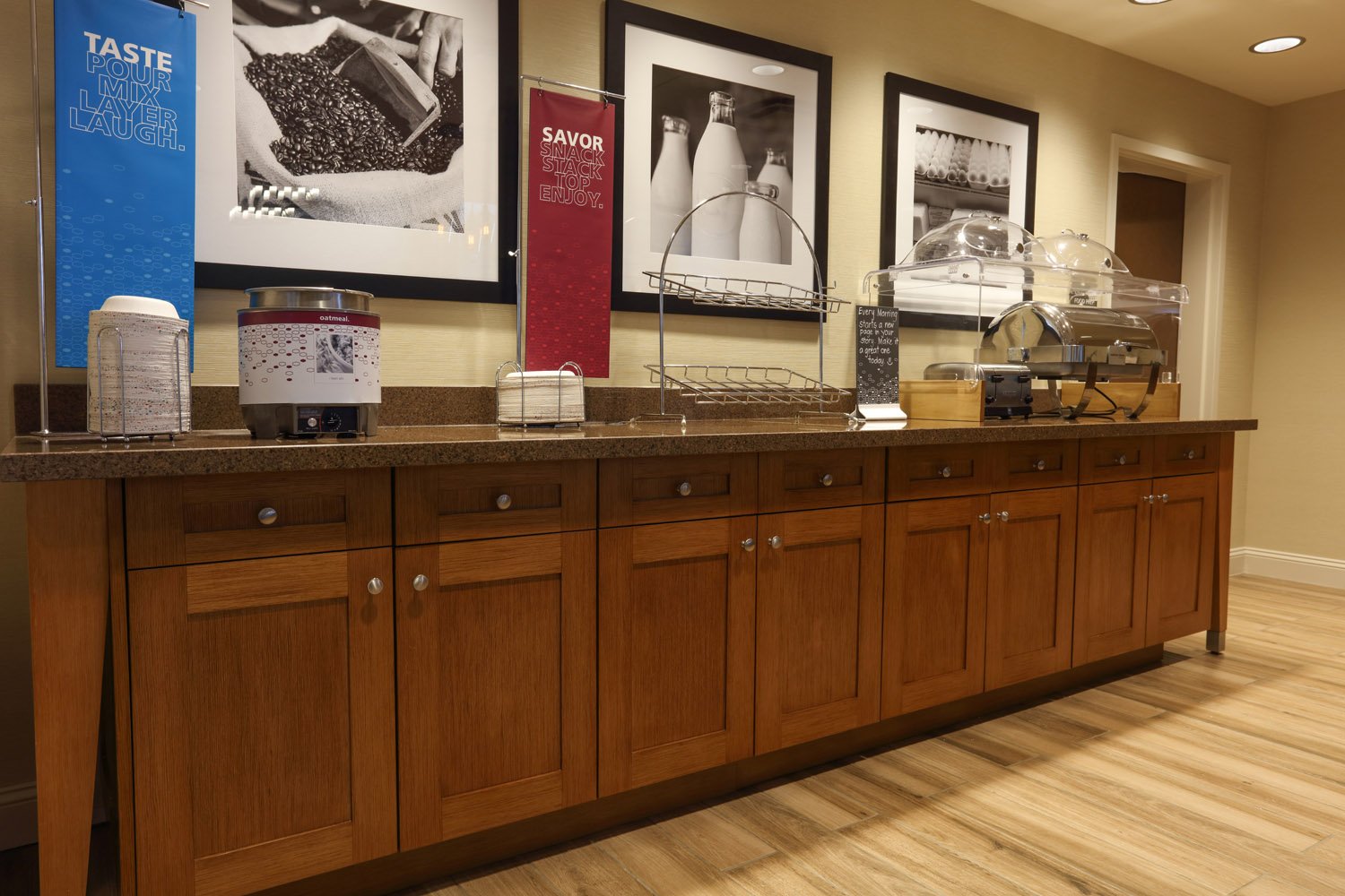 Hotel lobby millwork elements at breakfast bar - Hampton Inn and Suites