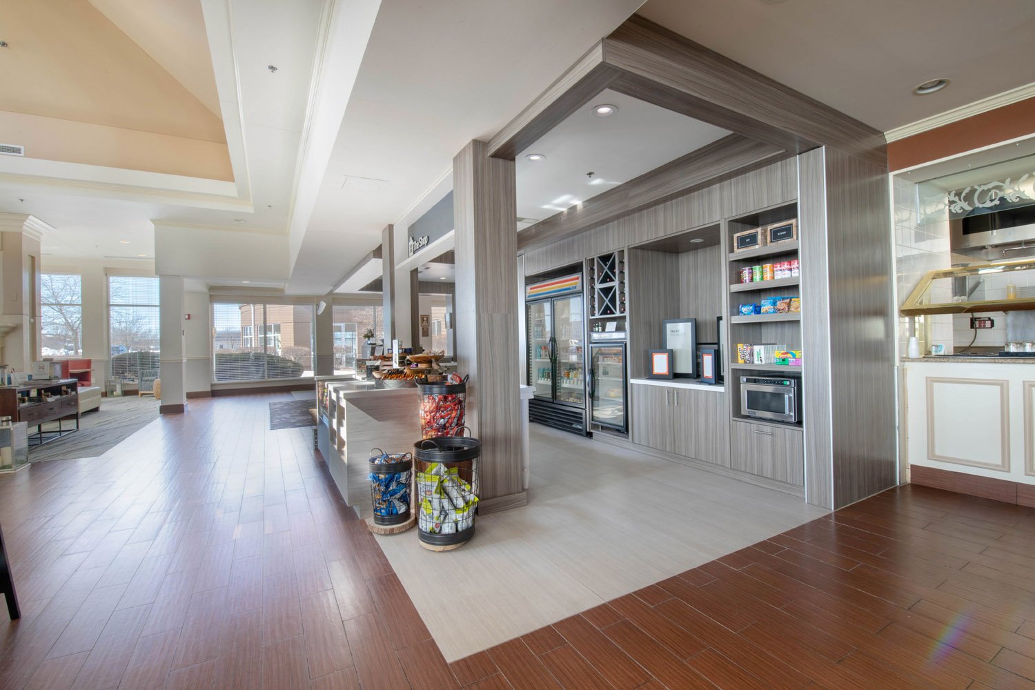 The Shop integrates into the lobby space with custom millwork done by EIS Hospitality