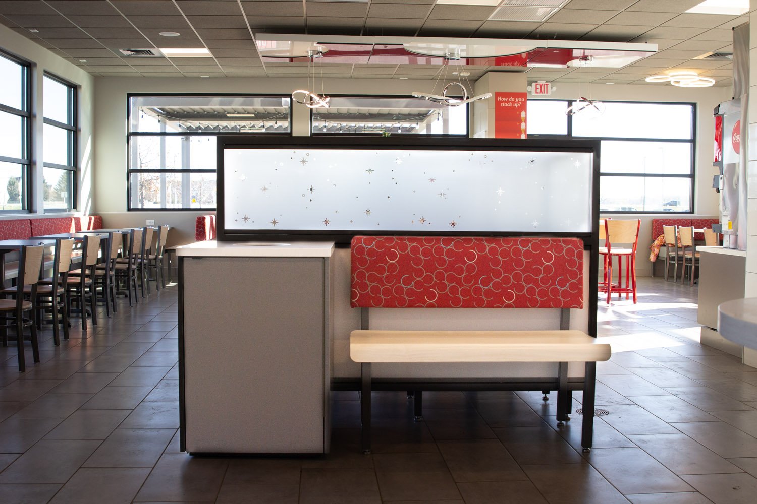 trash receptacles, divider screens, and banquette seating provided by EIS