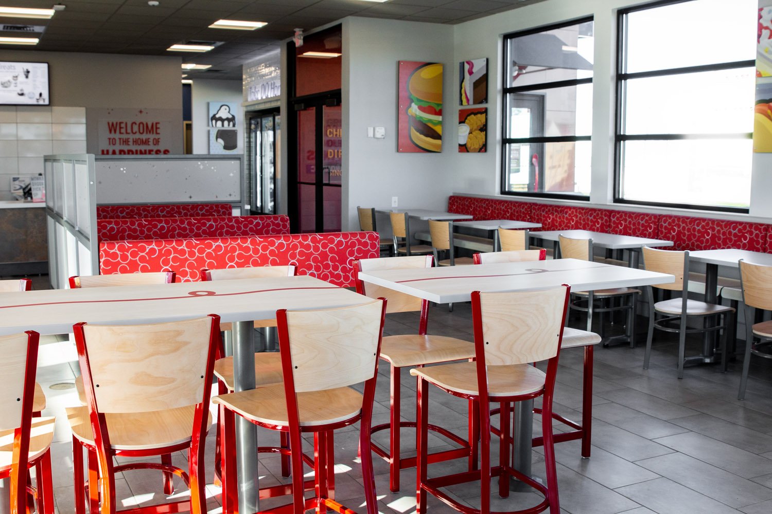 dining tables and booths inside DQ Grill and Chill