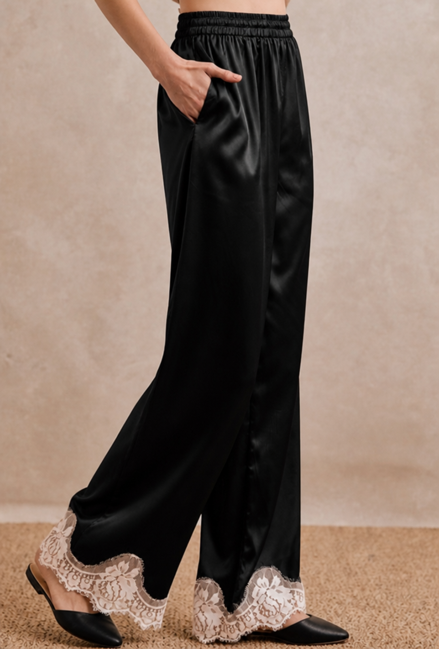 Black satin lace-hem pants.png