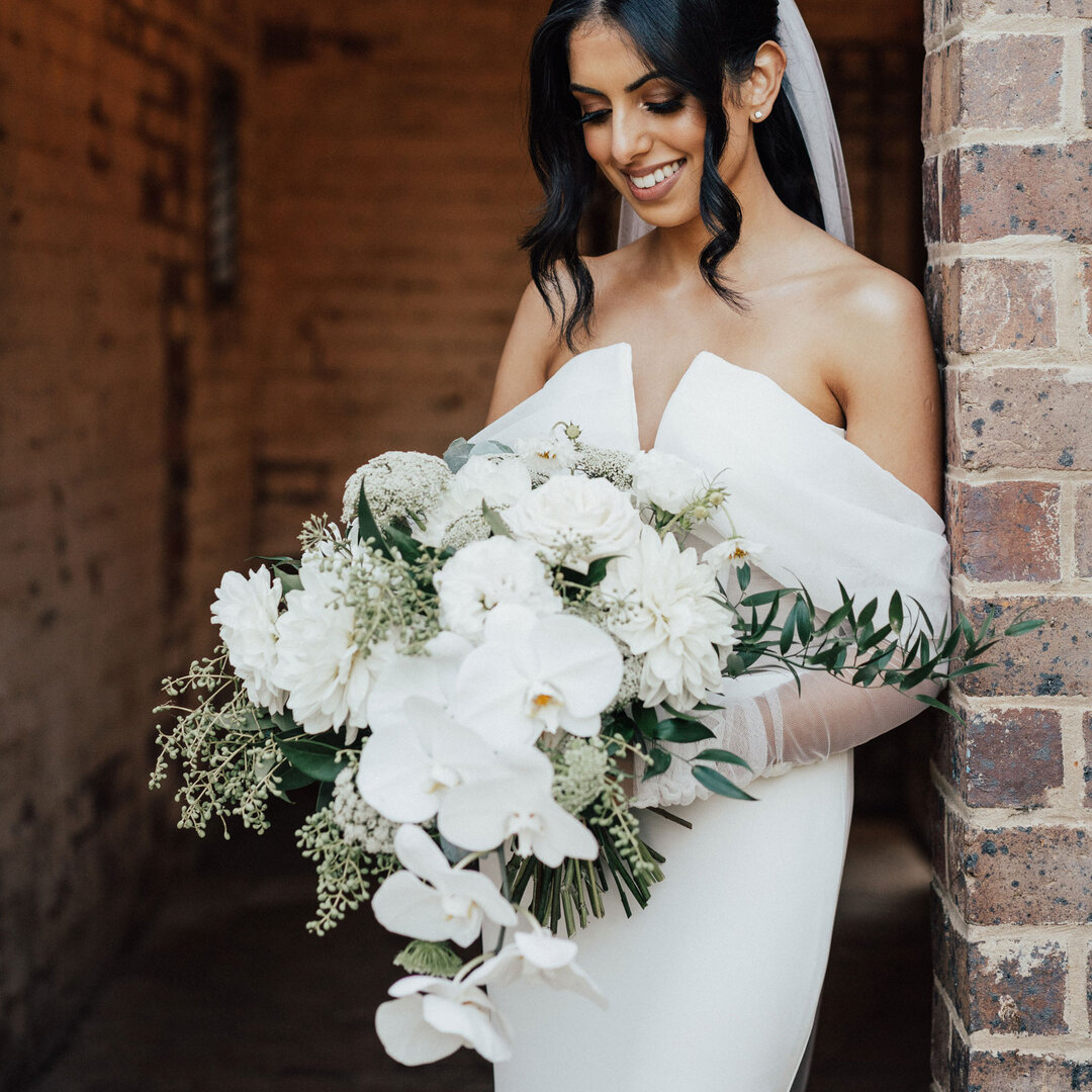 The gorgeous Susanna, admiring her classic white bouquet in a peaceful moment before the party started.​​​​​​​​
​​​​​​​​
Pic by the one and only @rick_liston​​​​​​​​
At @stonesoftheyarravalley​​​​​​​​
​​​​​​​​
#iheartflowers #classicwhitewedding #whi