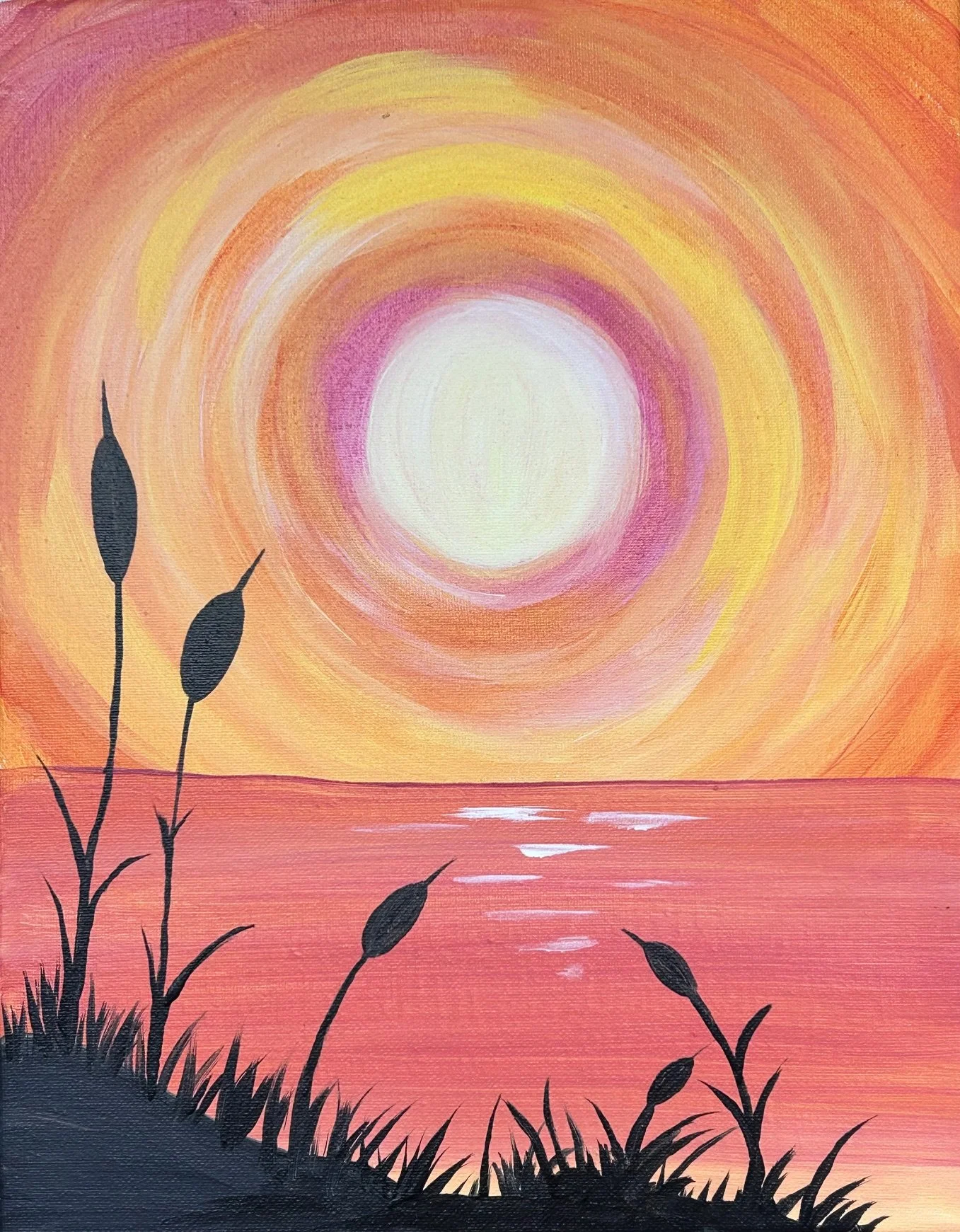 A painting with a sunset scene featuring a large bright sun, concentric circles of yellow, pink, and orange radiating from it, a body of water reflecting the colors, and black silhouette plants and grasses in the foreground.
