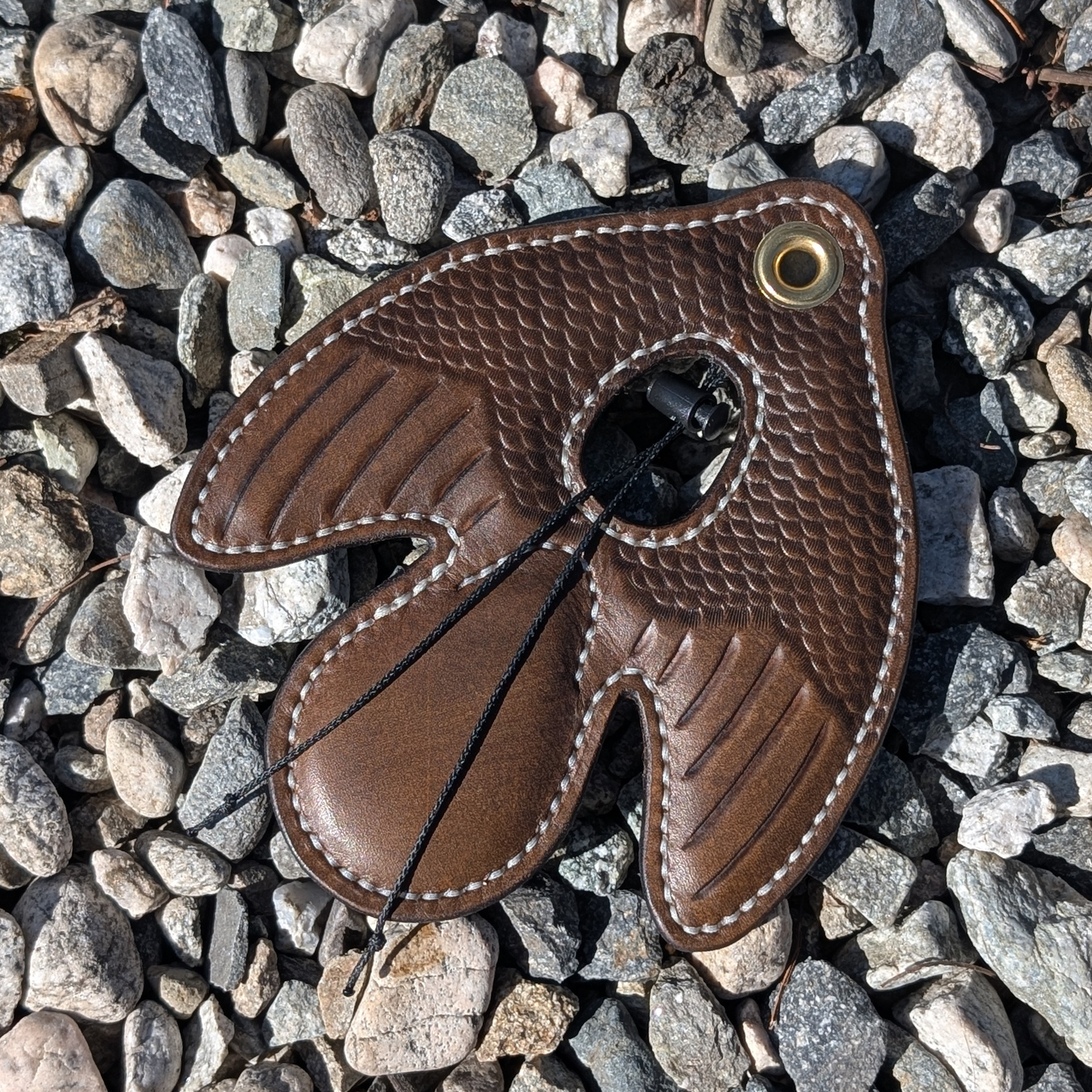 Dark BrownTooled Dove Lure.png