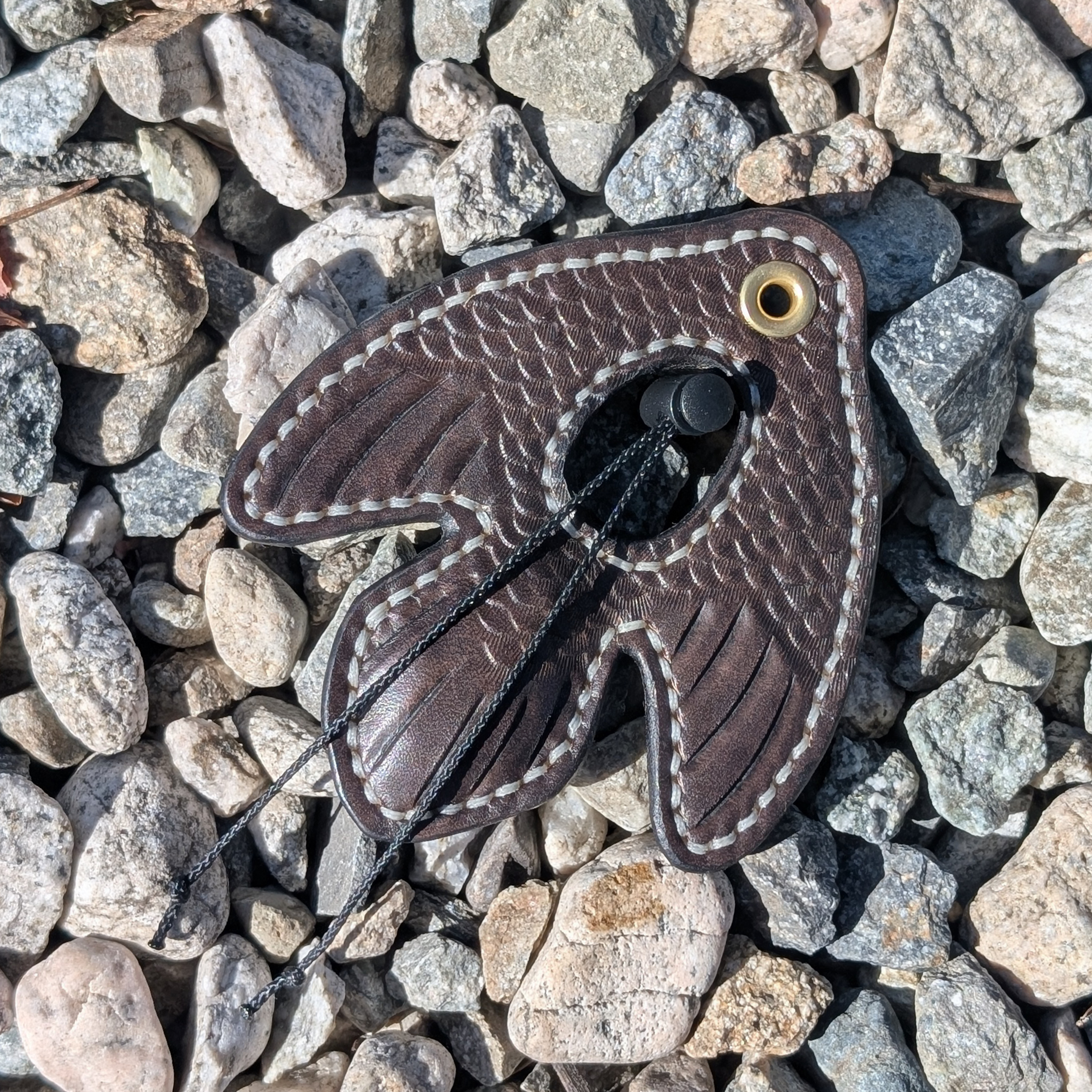 Dark Brown Tooled Sparrow Lure.png