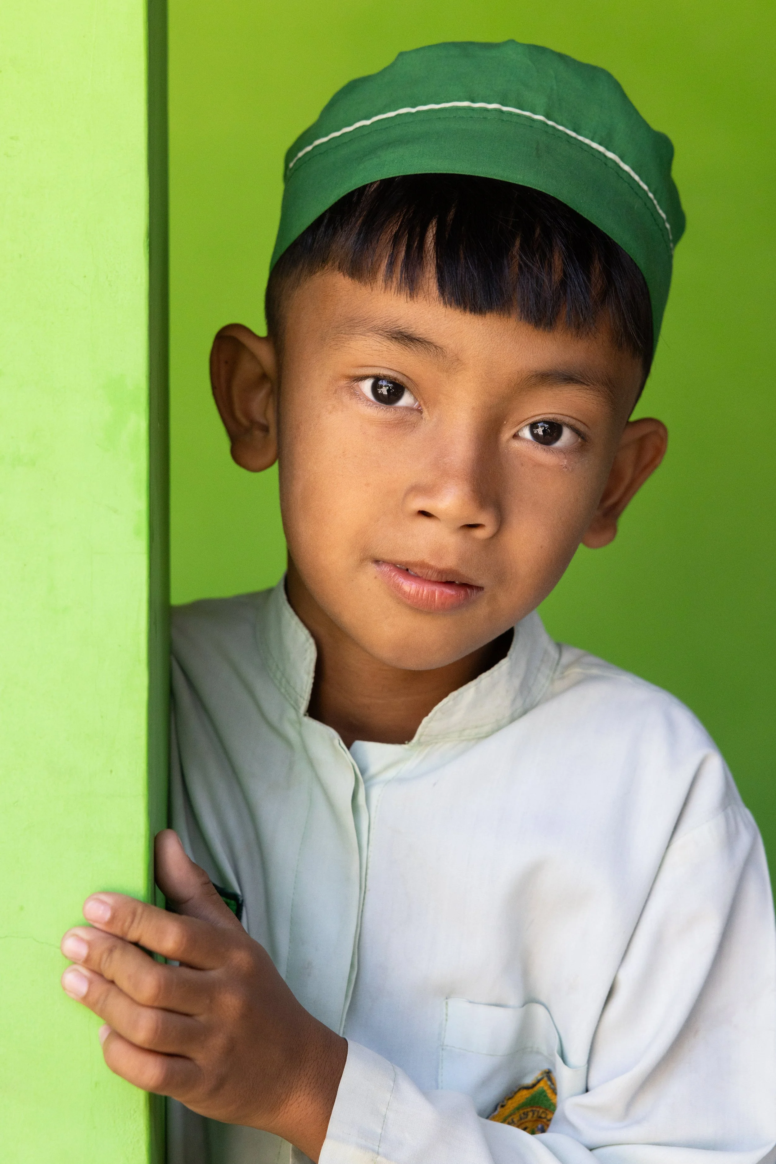 Indonesia, 2024 - Schoolboy in Green Hat