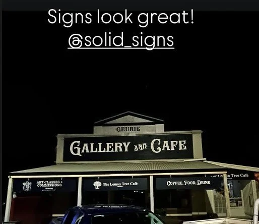 Sign for Gallery and Cafe with additional signs for art classes and commissions, The Lemon Tree Cafe, and Coffee Food Drink.