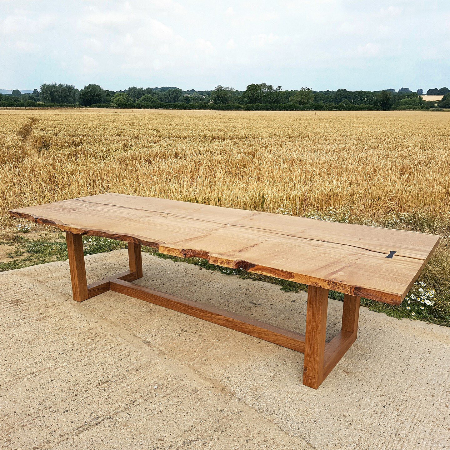 Did you know that we make tables, too?

We love this project - an incredible single board of quarter sawn English Oak, over a meter wide and 3.5 meters long, with a live edge that contrasts beautifully with the square geometry of the base. And those 