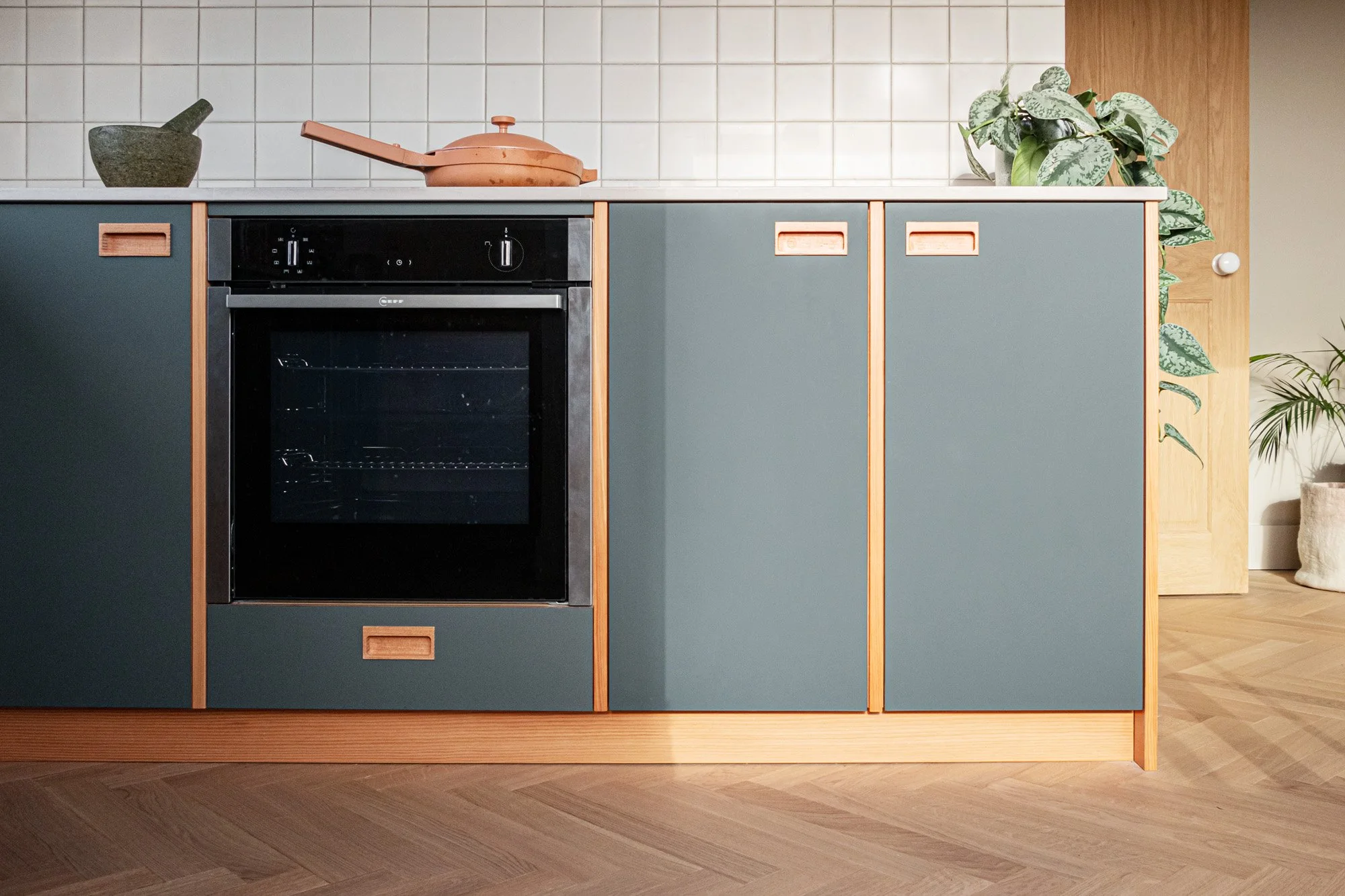 Lots of lovely pink and green tones in this North London kitchen.