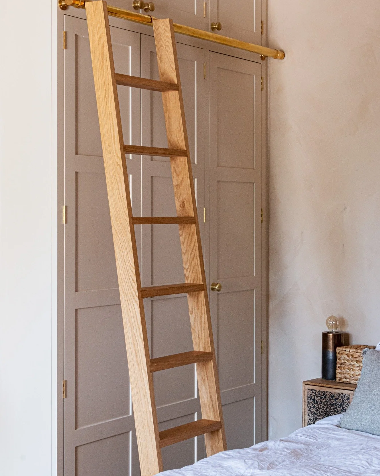 Some classic Shaker wardrobes and an oak ladder for a beautiful seafront apartment in Brighton.