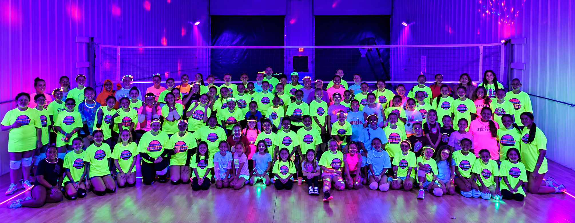 Neon-lit volleyball group portrait 5.PNG
