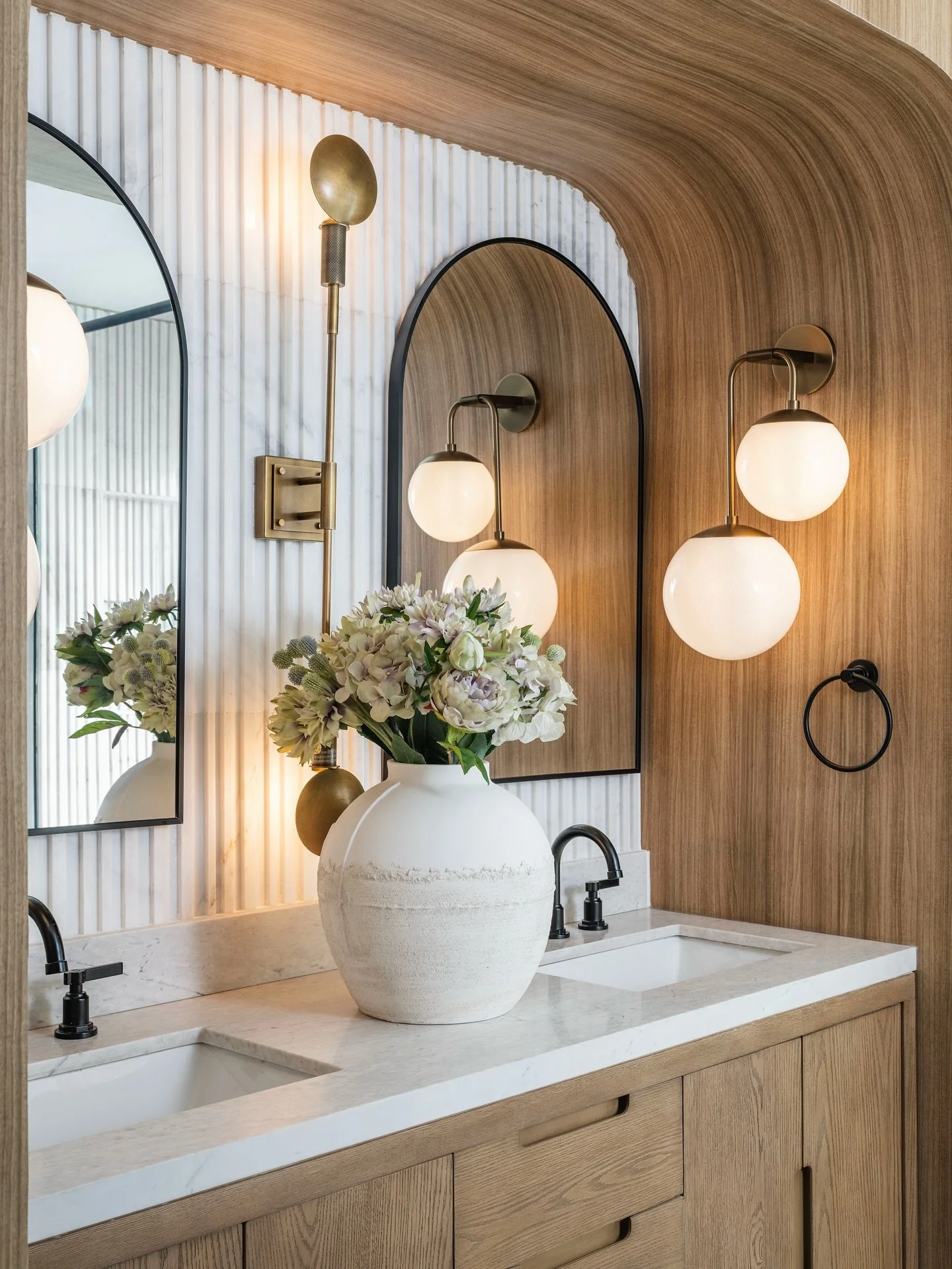 The difference between the two pictures is that when you looked at the after (swipe 👈🏿 to see), you only saw a shower&hellip; I saw the opportunity to give my clients the double vanity you see in first picture. They have been sharing one sink for m