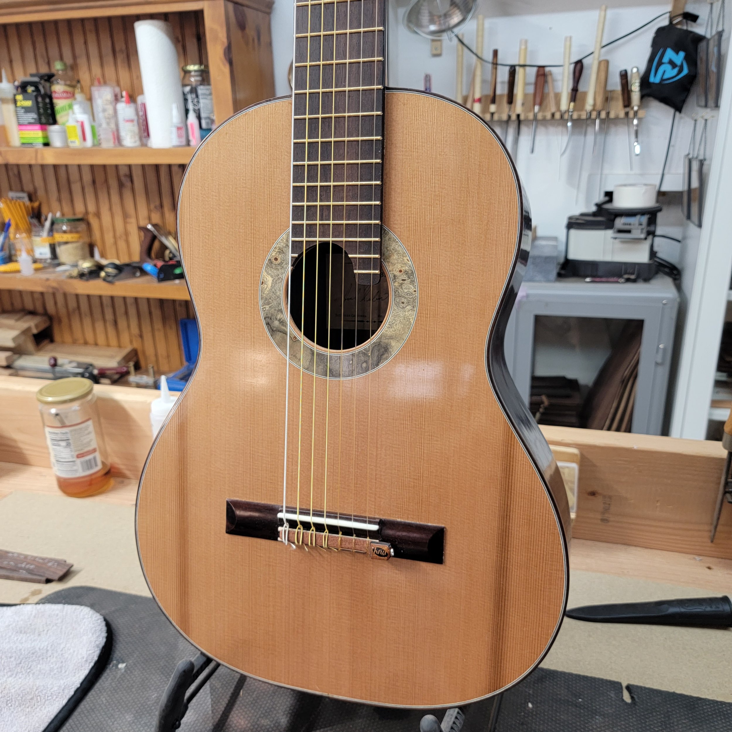 Cedar soundboard w pick-up installed on bridge.