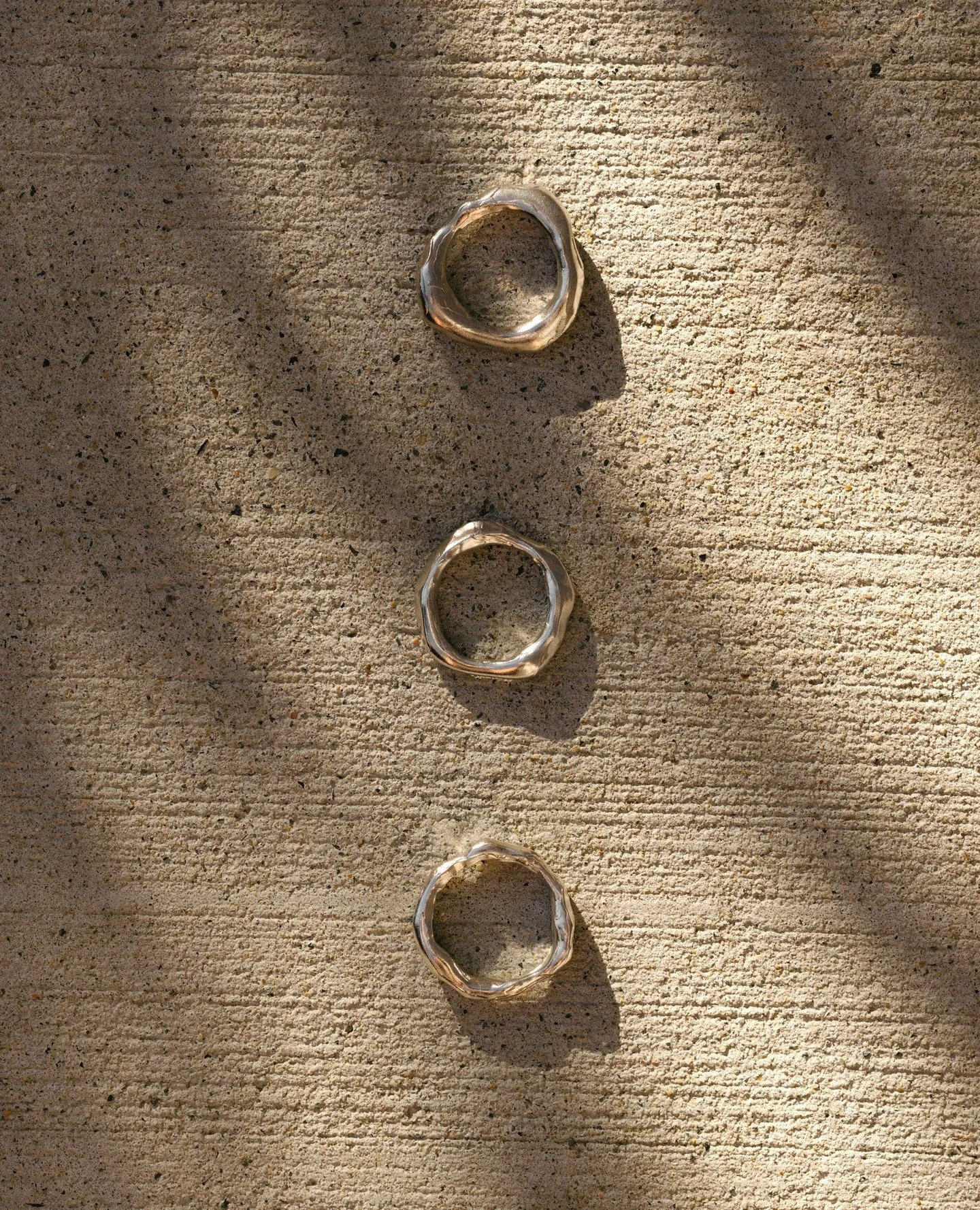 Three rings, inspired by organic forms and the fluid movement of water.