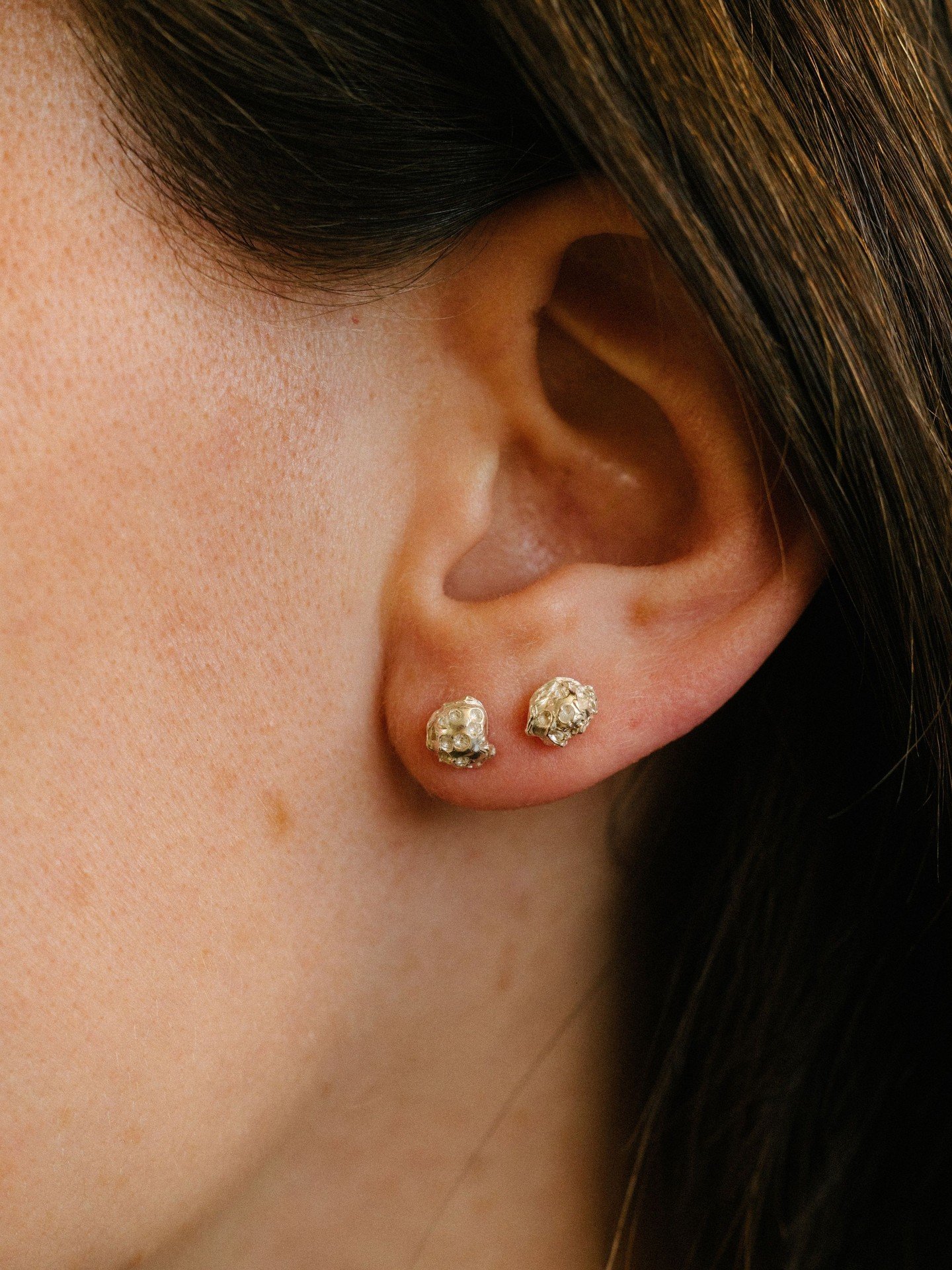 The Pod earrings, worn simply