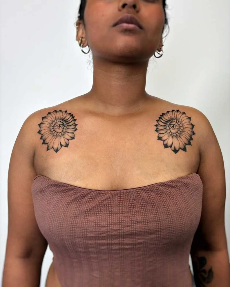 Symmetrical collarbone tattoos by Kuya (@kuya.tattoos), surreal tattoo expert at top-rated tattoo studio, Dark Water, in Berkeley, California
