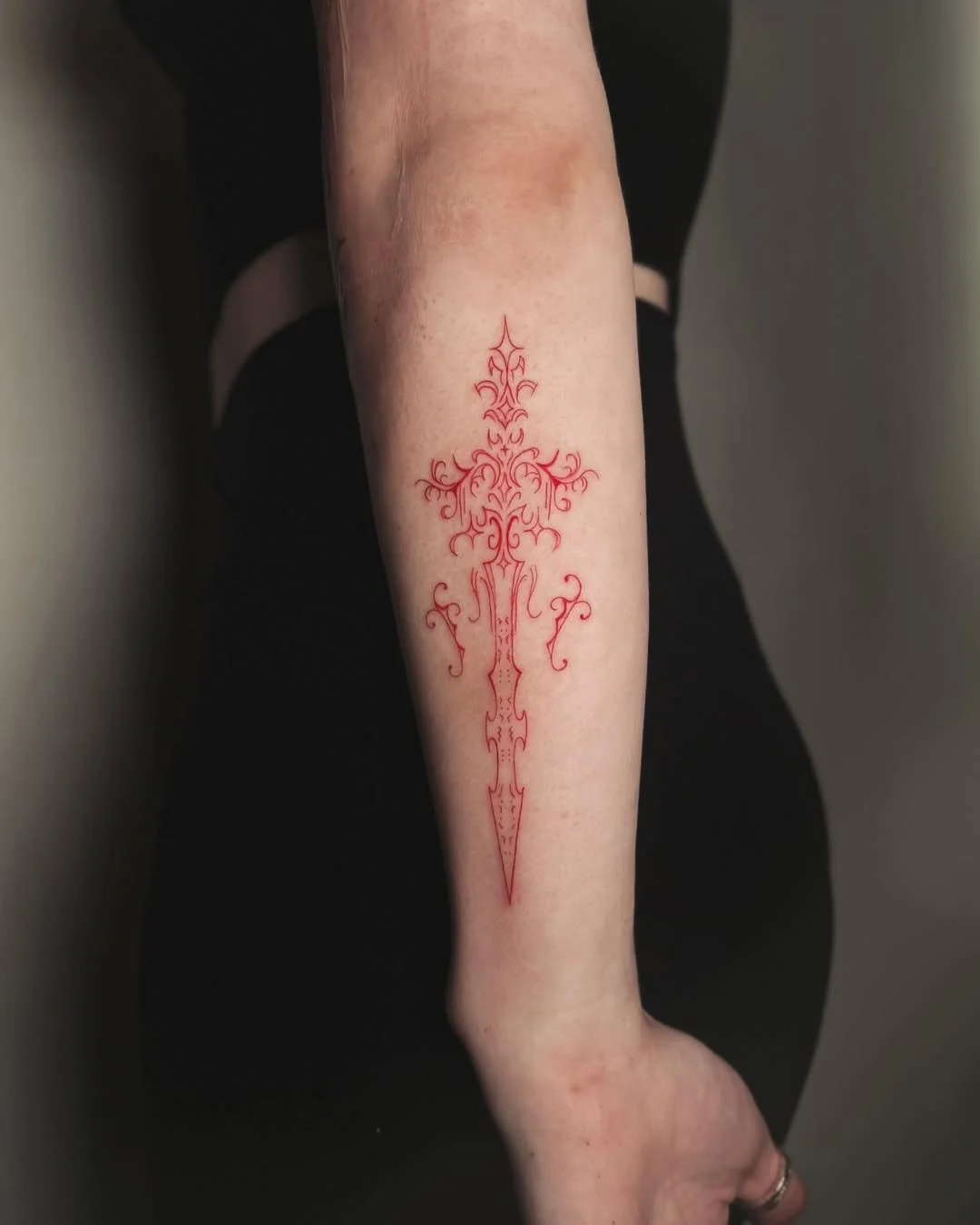 Red ornamental dagger
All-red fineline ornamental dagger with cybersigilism flourishes — a clean, gothic forearm piece. By Stella Sanchez (@umbra.inks), now booking at Dark Water Tattoo Studio in Berkeley.
