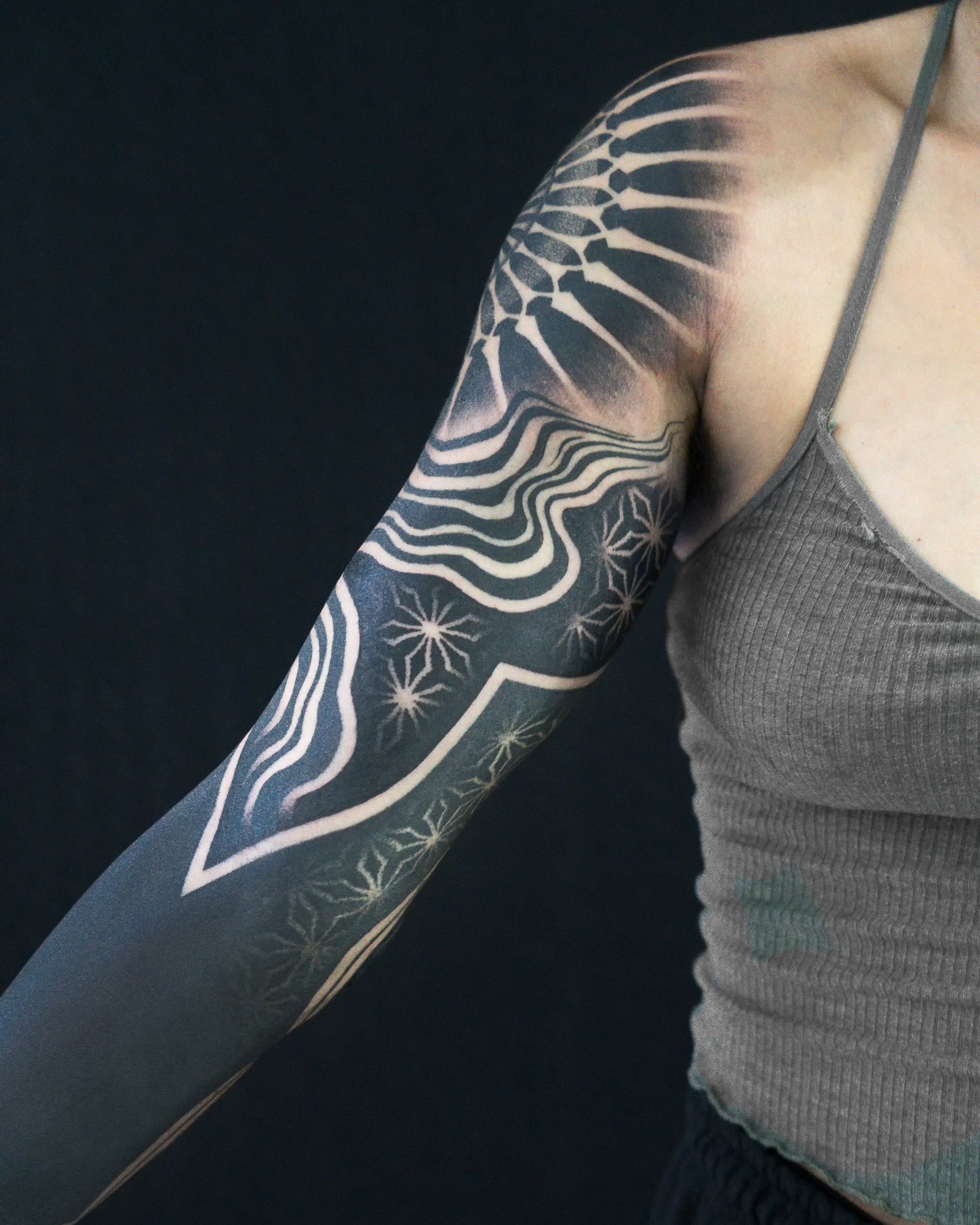 What do you call this type of tattoos ? (The full black arm one) also will  it cost a lot considering that it requires a lot of ink ? Even tho it