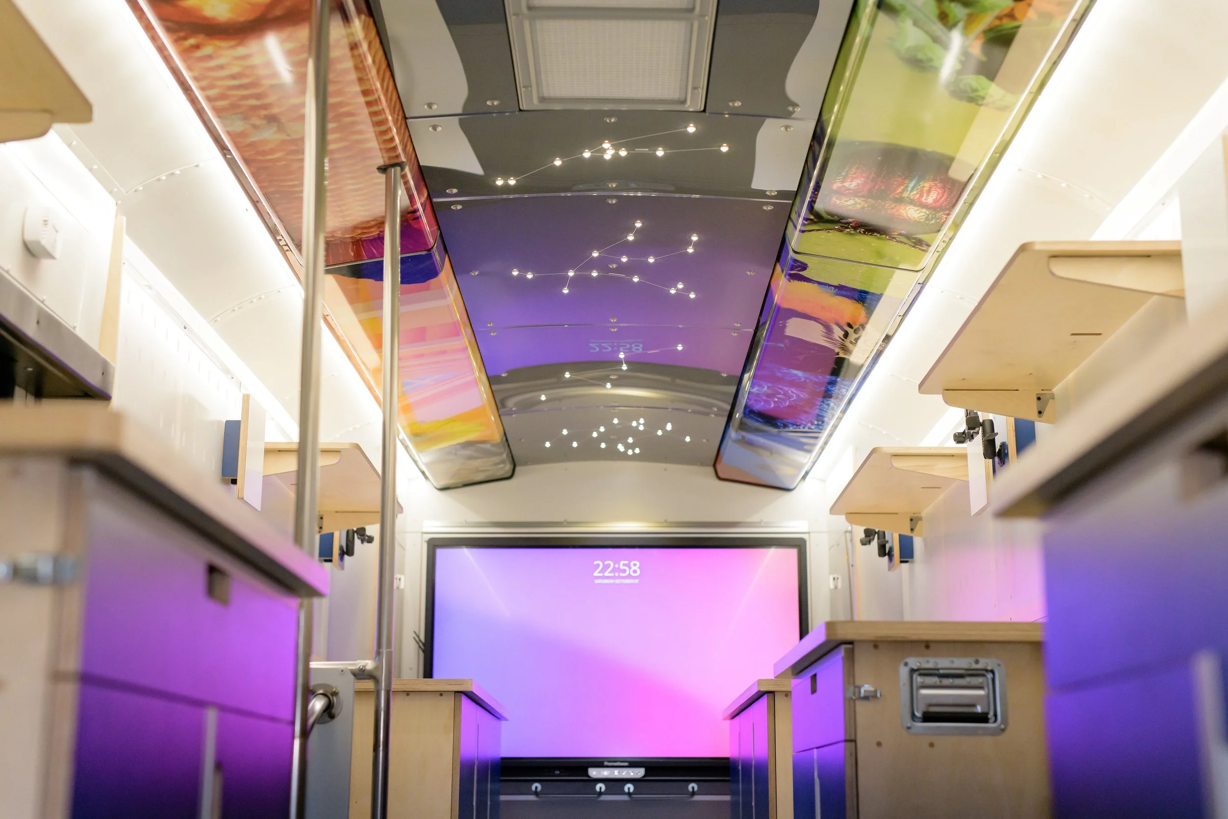 Custom ceiling with integrated monitor. 