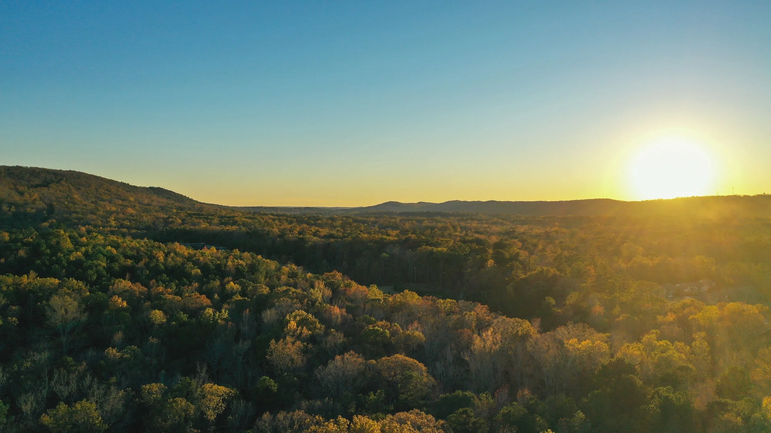 Peaceful mountain landscape at sunset representing healing, growth, and holistic mental health counseling at Sharp Wellness in Alabama.