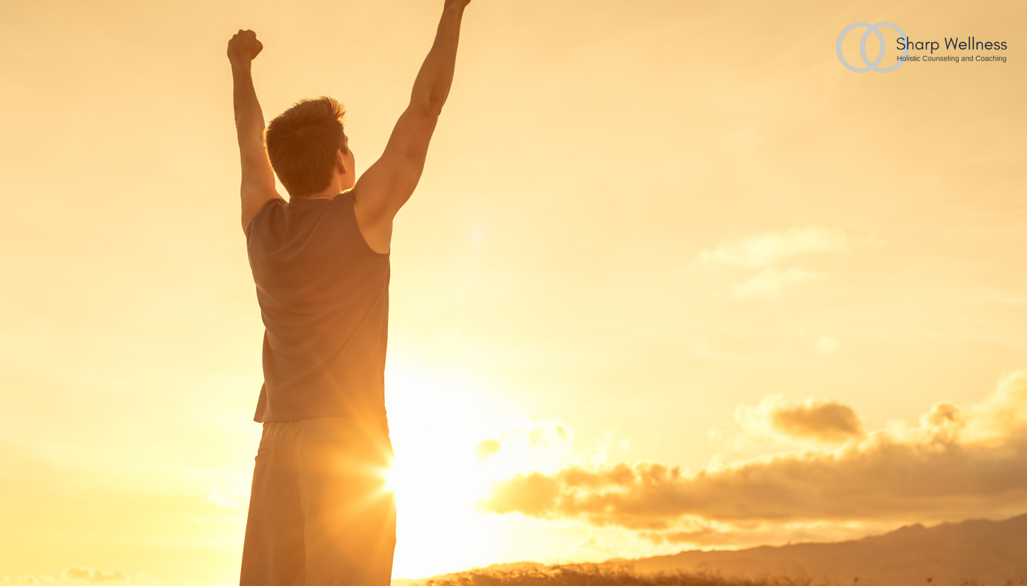 Person standing with arms raised at sunrise, symbolizing emotional resilience, healing from burnout, overcoming anxiety, and mental health counseling in McKinney, TX.