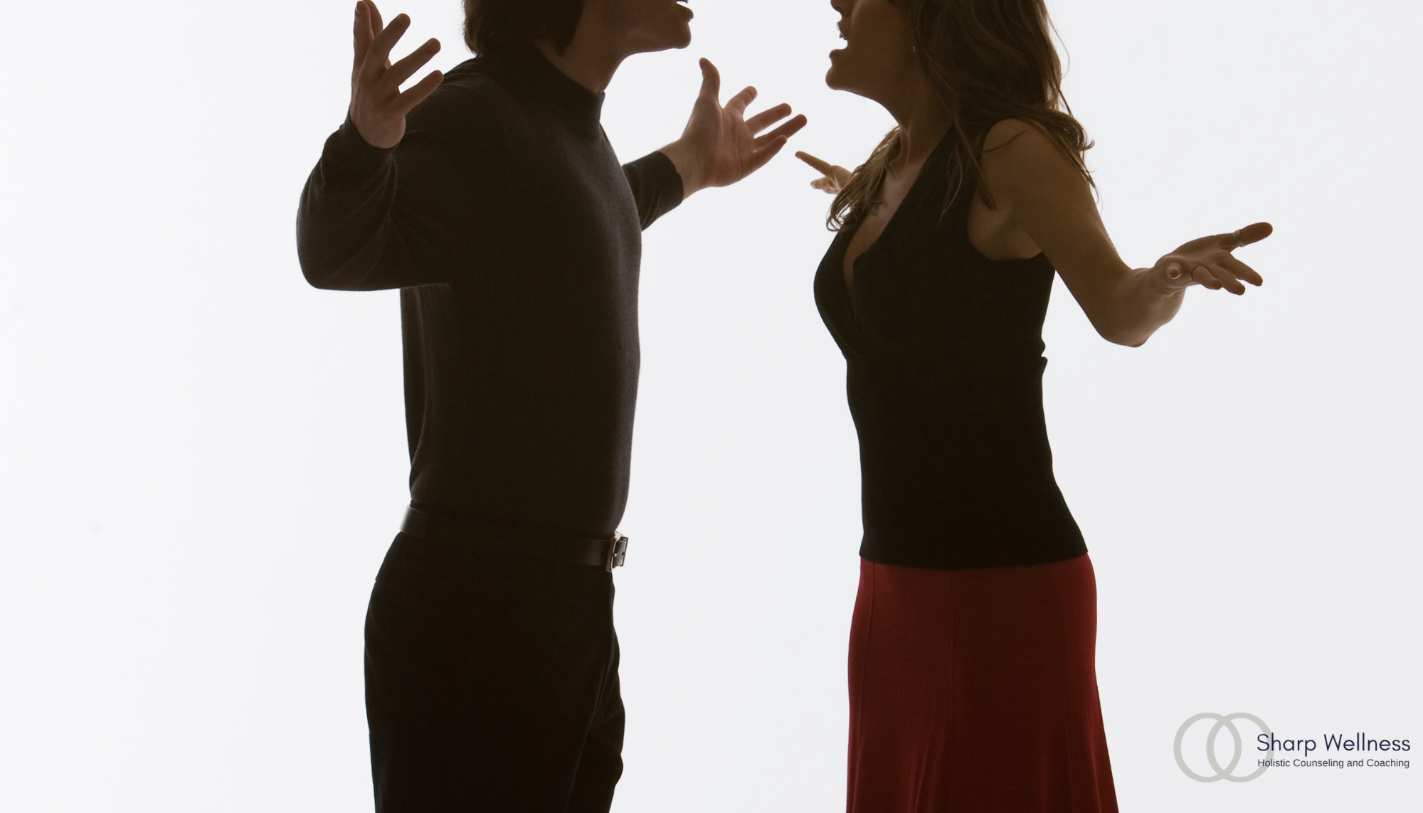 Couple arguing with expressive body language, representing relationship conflict, communication struggles, and using mental health language during disagreements.