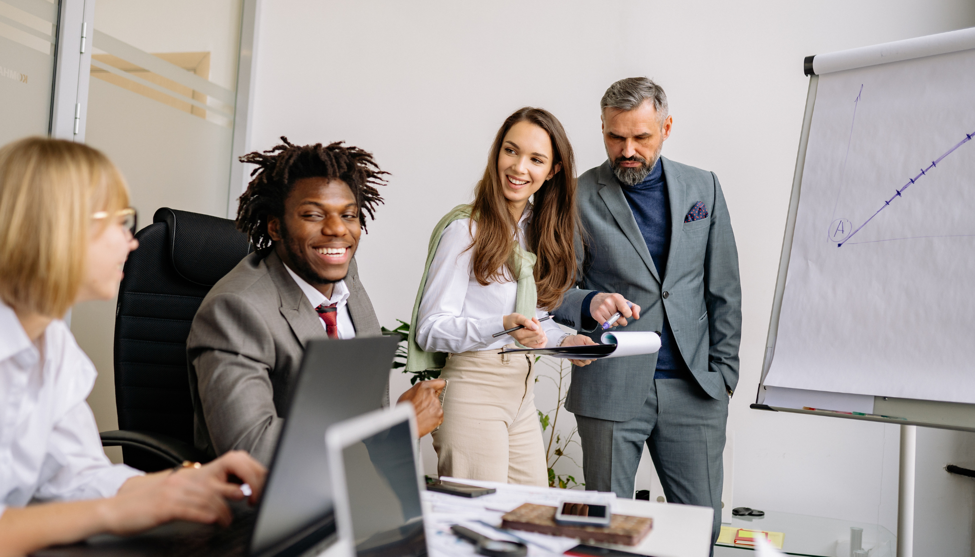 Coworkers collaborating in an office, representing workplace stress, job pressure, burnout, and stress management therapy for adults.