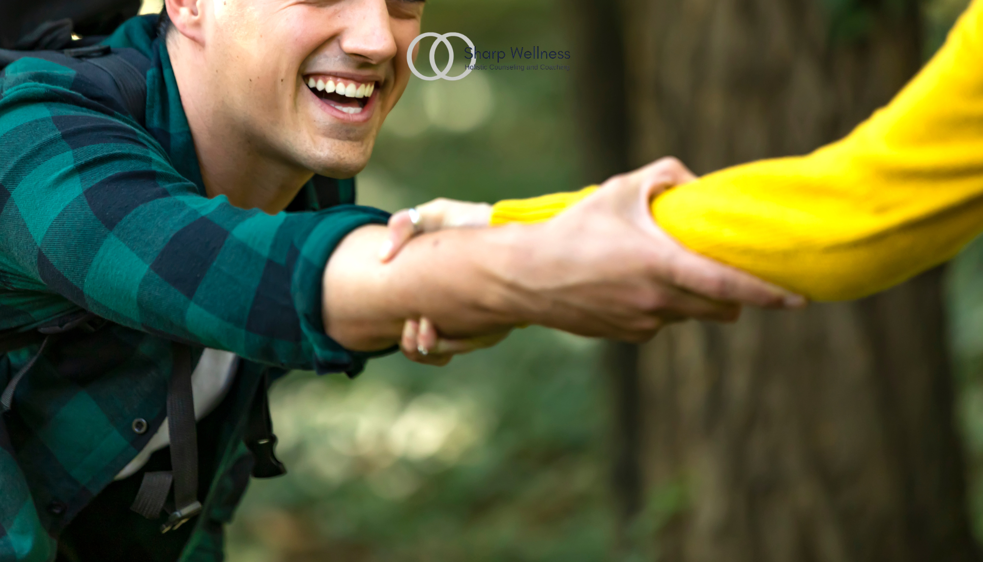 Man reaching out to help another person, illustrating the importance of asking for and accepting support in Birmingham, Alabama, and McKinney, Texas.