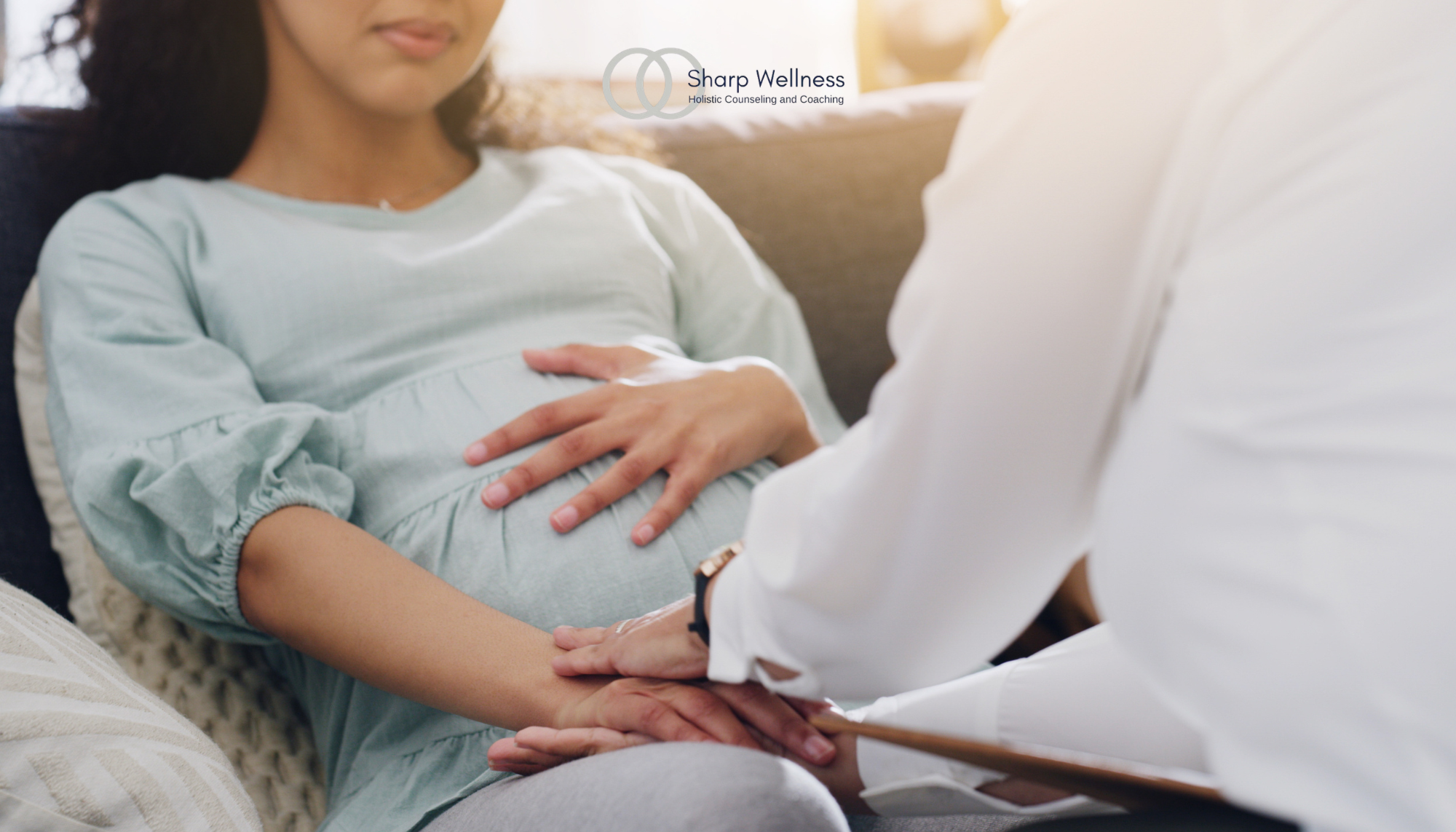 Pregnant woman receiving emotional support during a counseling session, representing perinatal mental health, pregnancy anxiety, and maternal therapy.