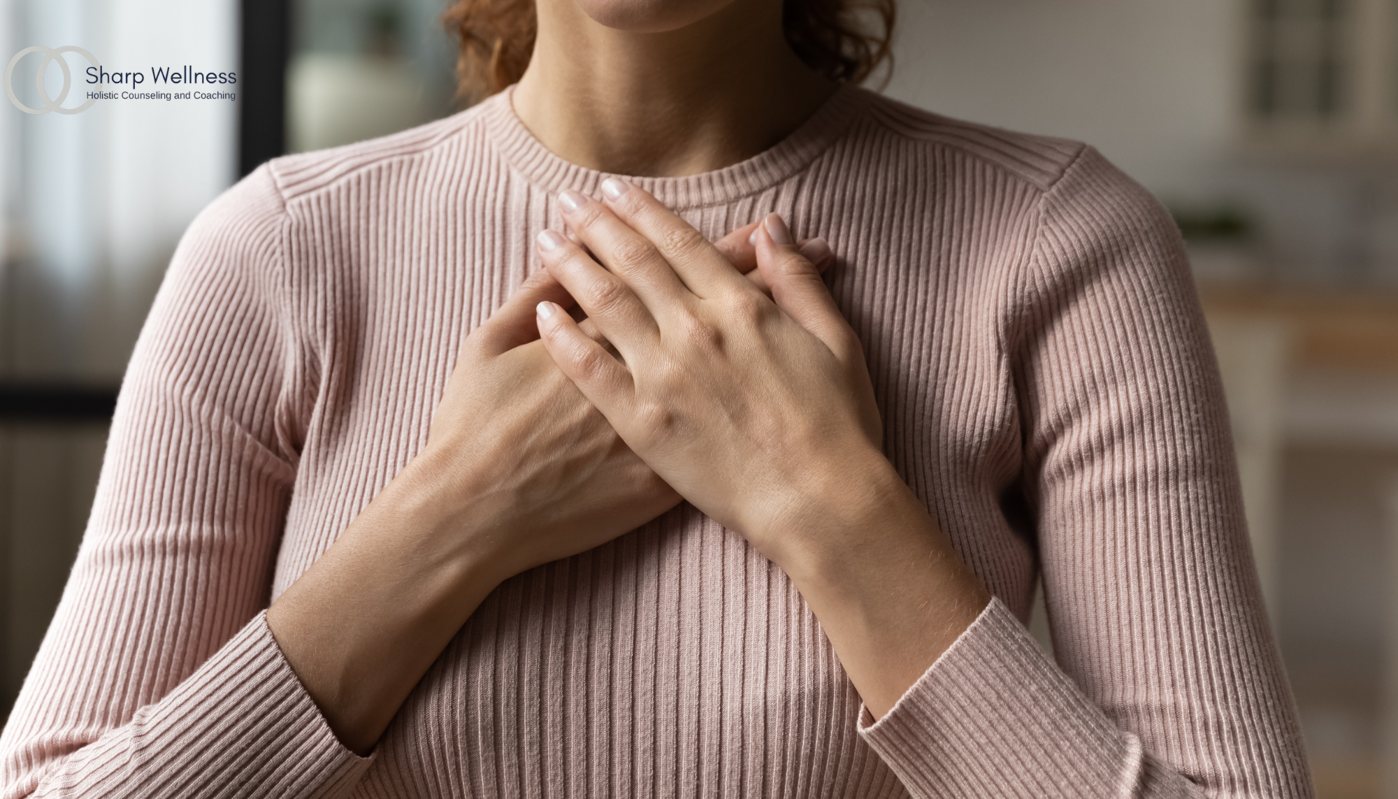 Individual experiencing chest tightness and physical symptoms of anxiety, illustrating stress, panic, and anxiety counseling services in Birmingham, AL.