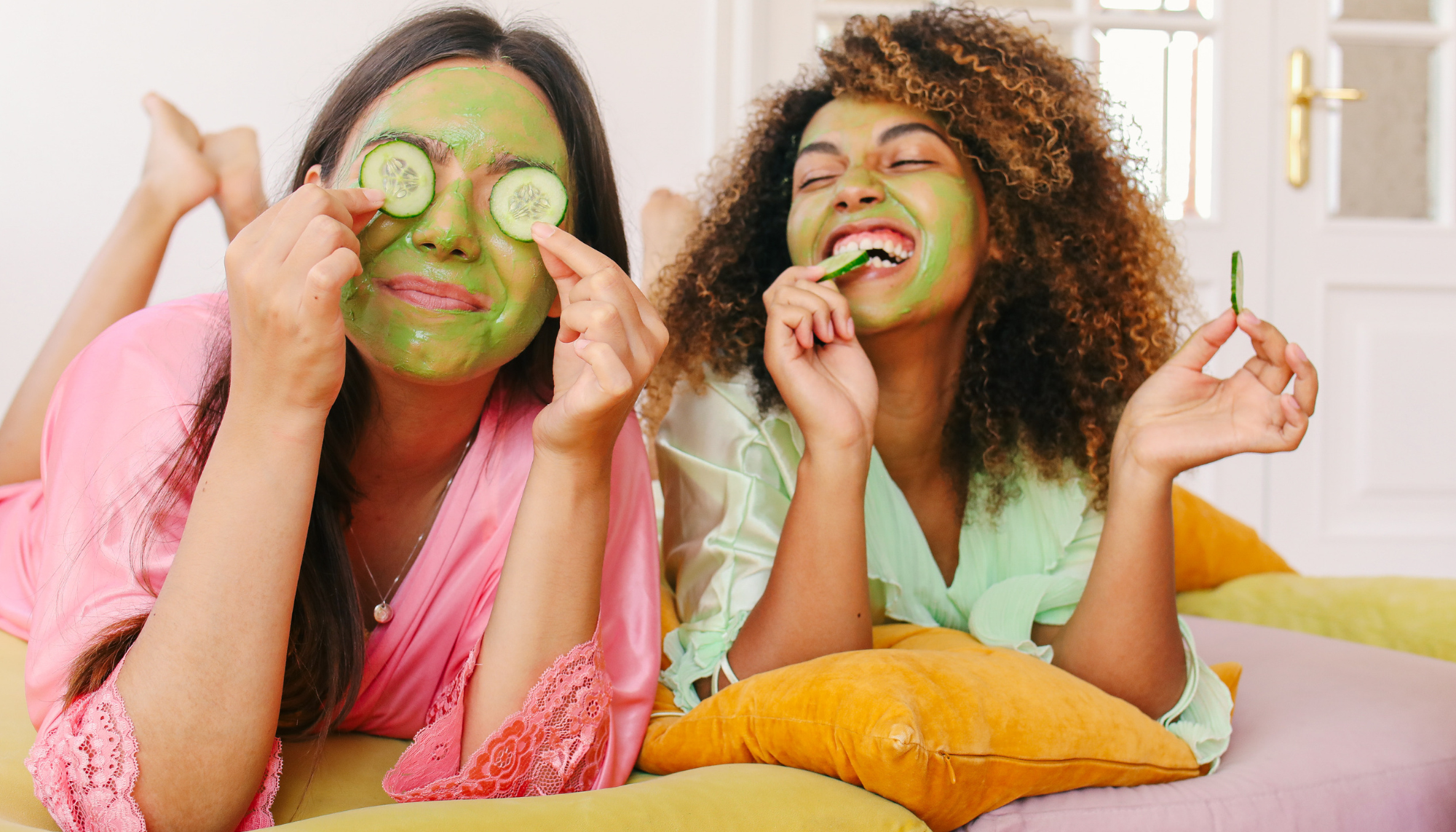 Two women laughing together during a self-care moment, representing healthy self-esteem, confidence, connection, and emotional well-being.