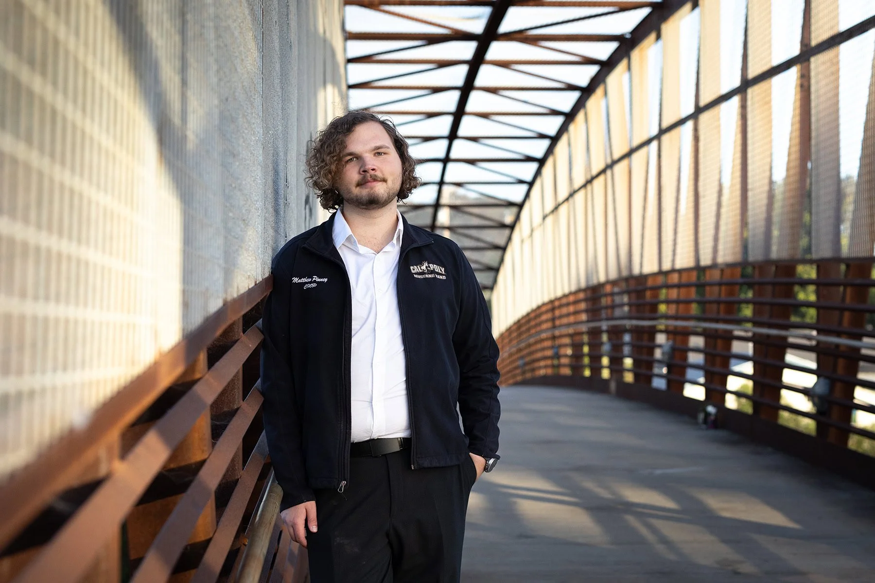 cal-poly-graduate-portrait-suspension-bridge-san-luis-obispo-golden-hour.jpg
